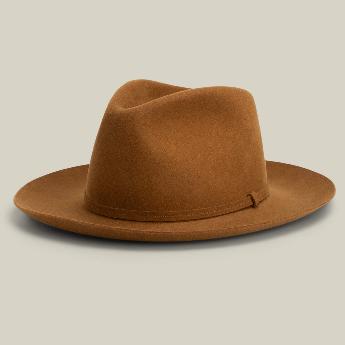 The Goorin Bros. Night Hawk is a brown felt teardrop crown fedora with a wide snap brim and matching band, shown against a light beige background.