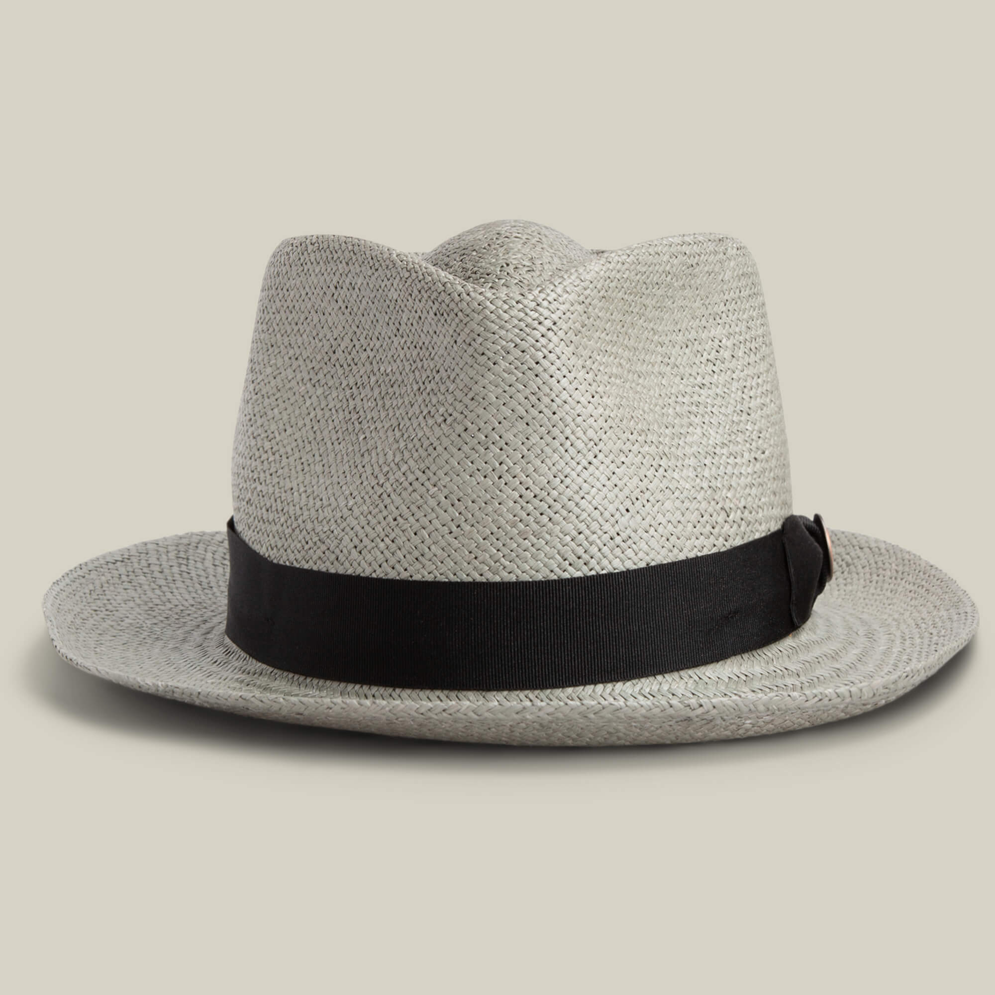 The Goorin Bros. John Sr. is a light gray toquilla teardrop fedora with a black crown band and 50 UPF sun protection, shown on a plain beige background.