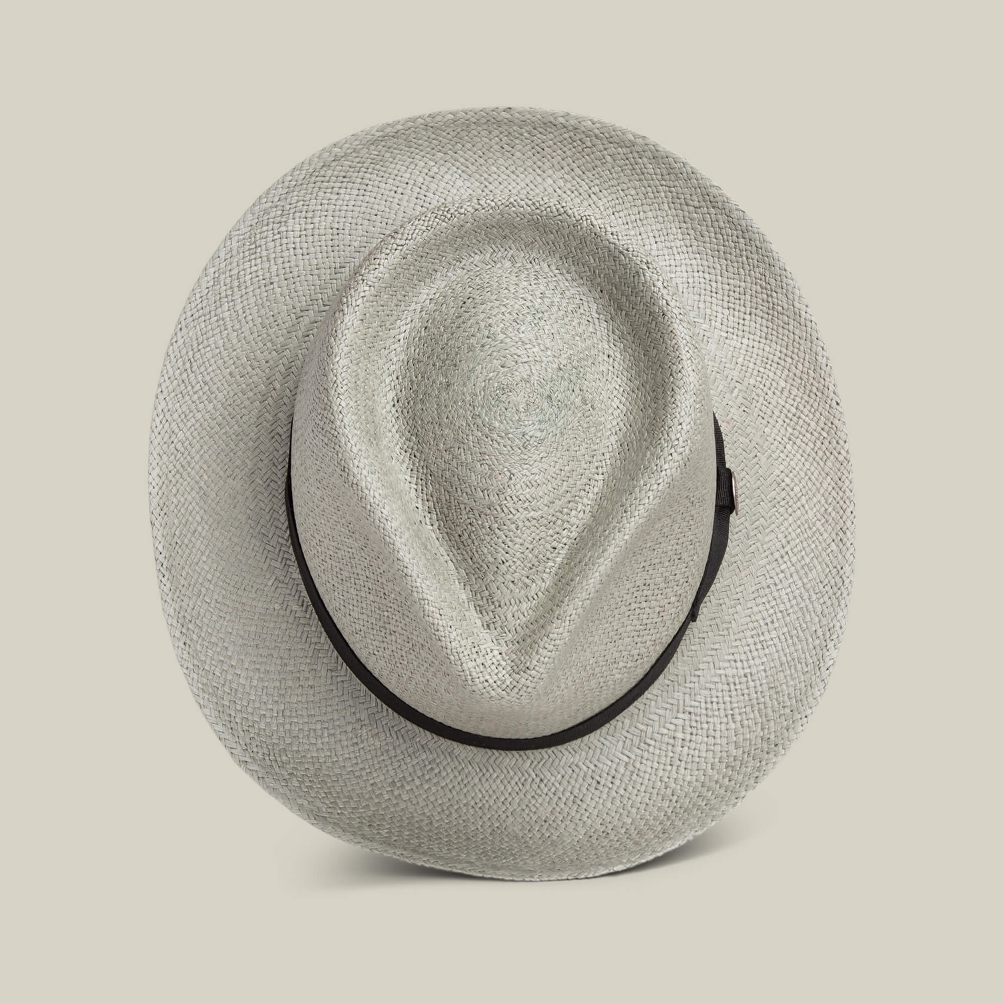 The Goorin Bros. John Sr. is a light-colored toquilla teardrop fedora with a black band, seen from above on a plain background—stylish sun protection with 50 UPF.