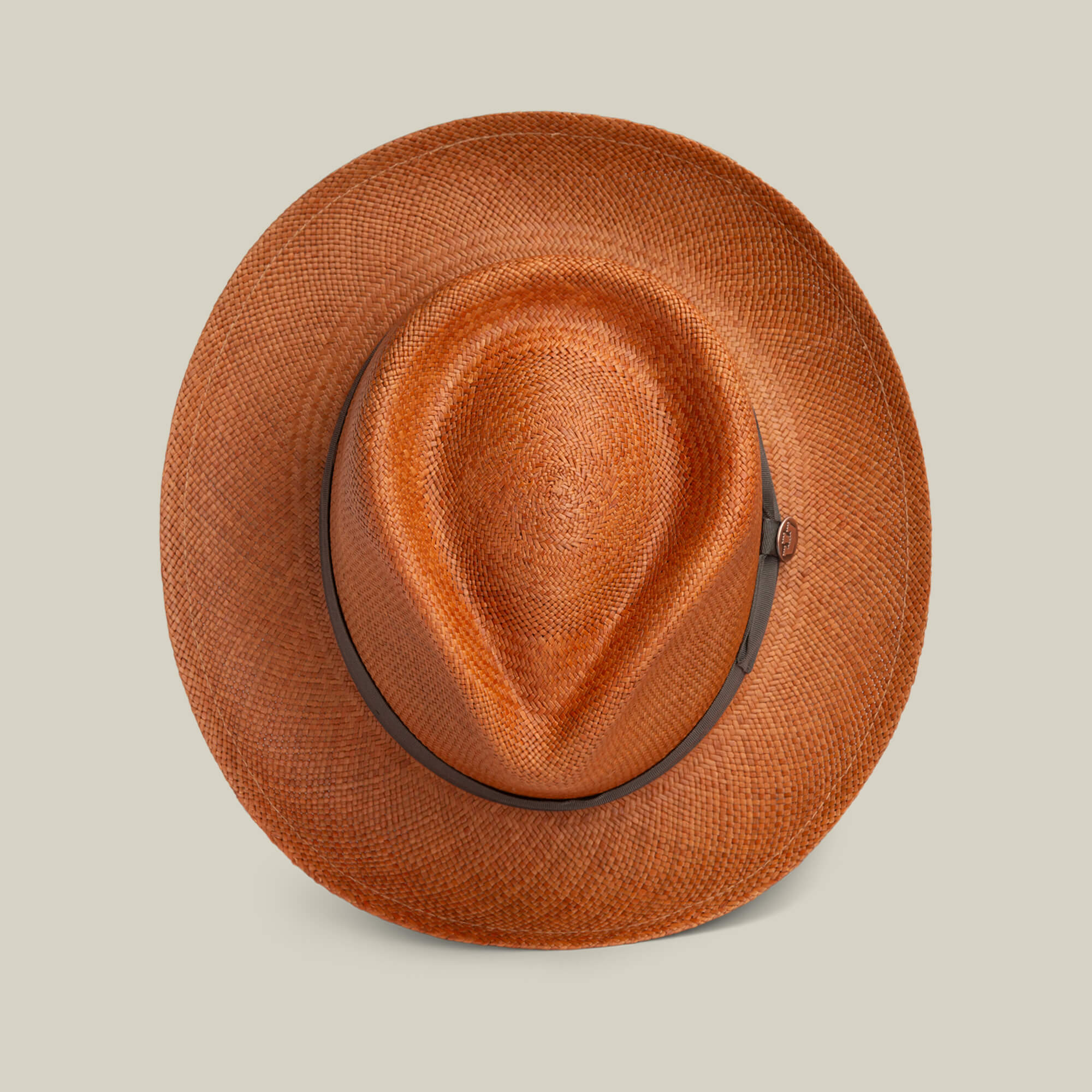 The Goorin Bros. John Sr. brown toquilla teardrop fedora features an indented crown, dark brown band, and 50 UPF stylish sun protection, pictured against a plain light background.