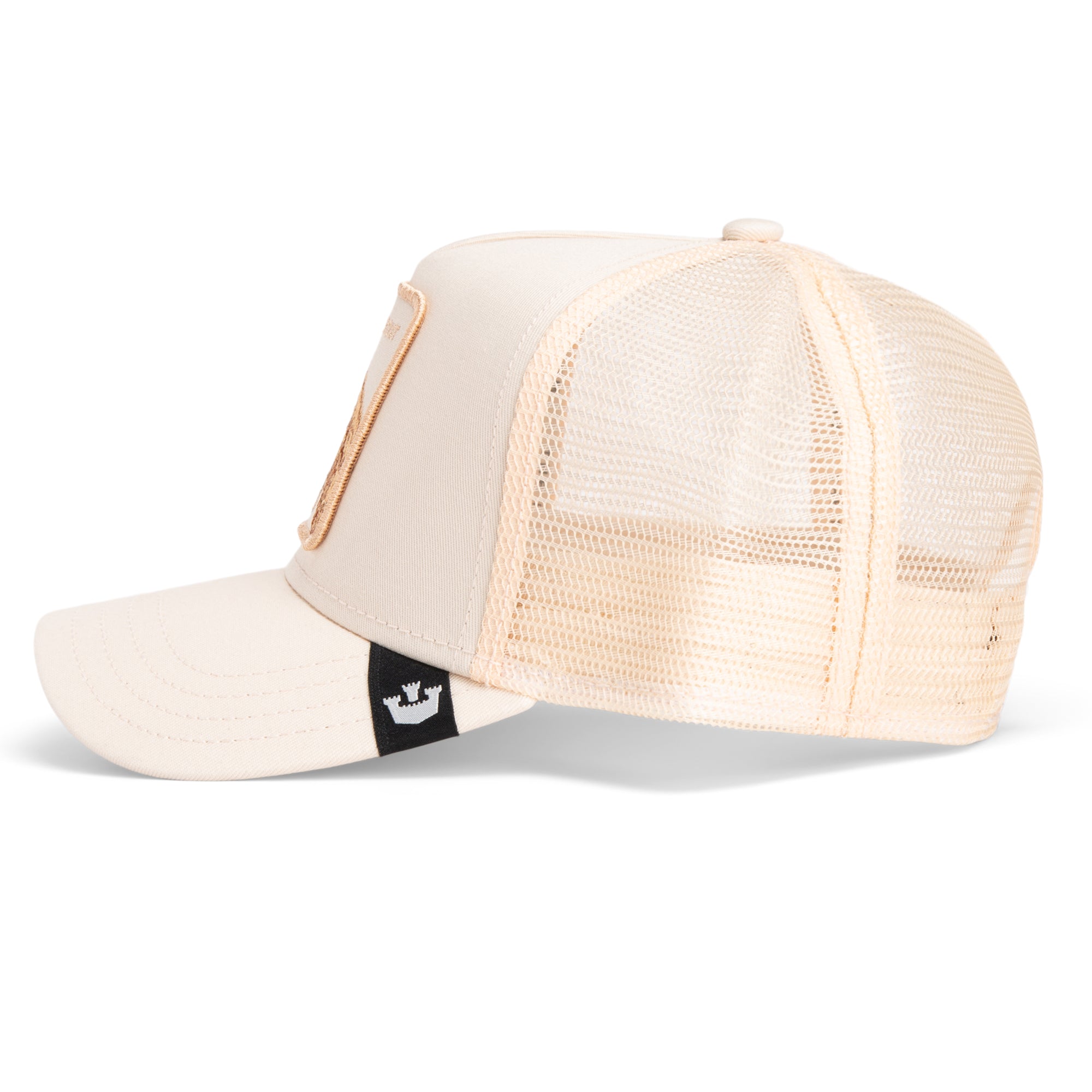The Far Out Mirage by Goorin Bros. is a beige trucker hat with mesh back, curved brim, and a small black logo tag—part of the Chroma Wave collection inspired by golden hues and modern style.