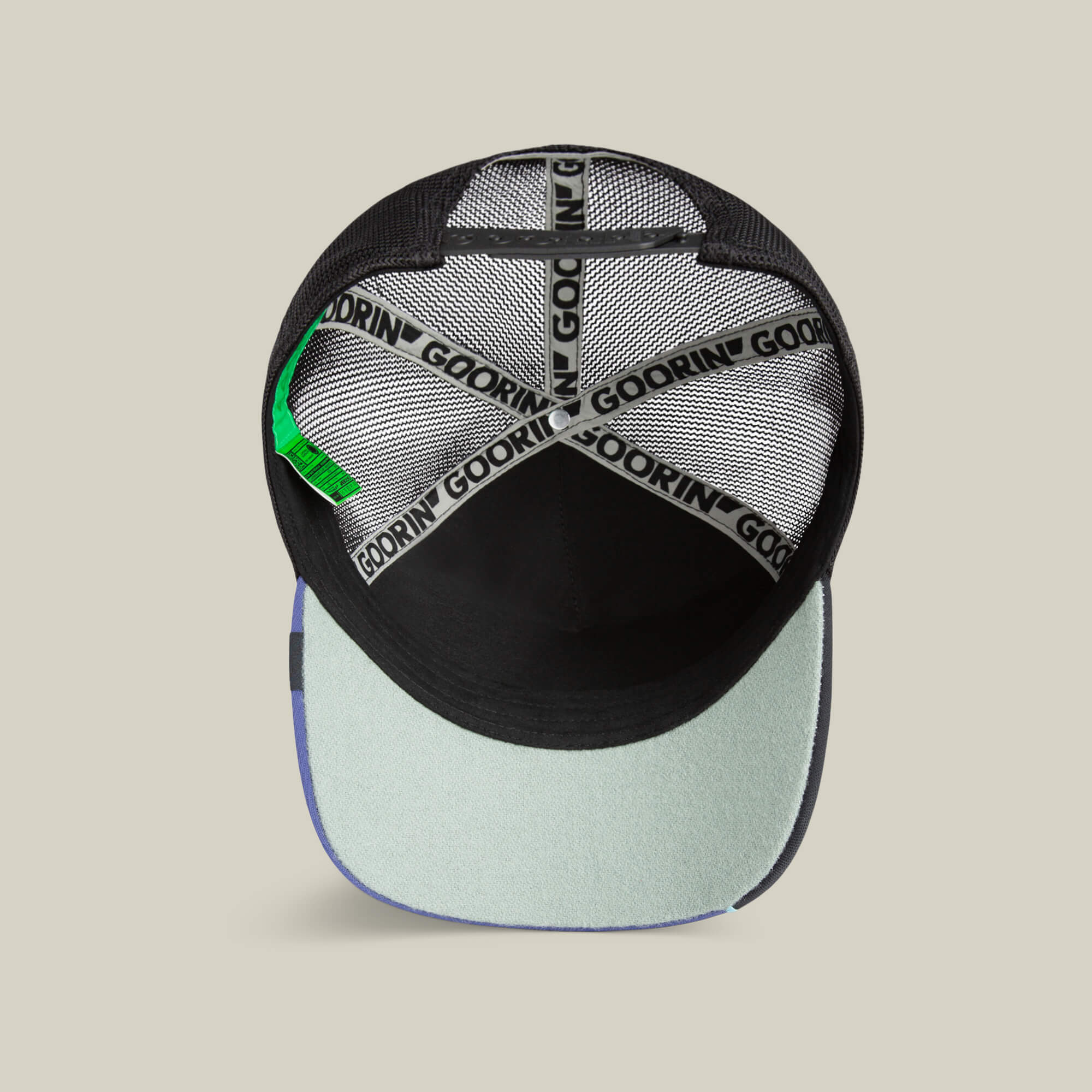 Top view inside the Goorin Bros. Means Yes hat reveals black mesh, Goorin-branded inner bands, a green tag, and a light blue brim underside—making it a standout accessory for any collection.
