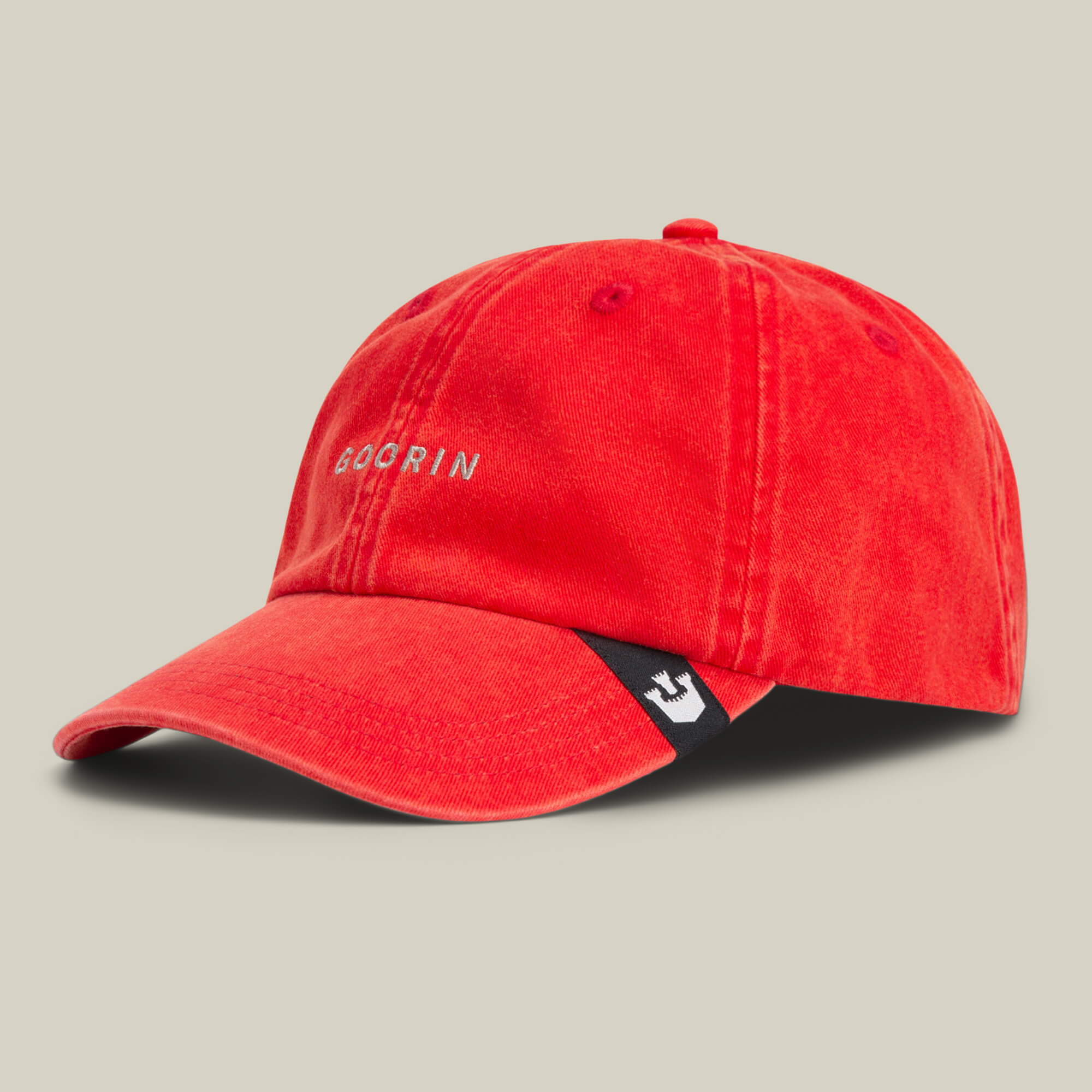 The Papa Cap Italiano by Goorin Bros. is a red baseball cap featuring GOORIN embroidered in white on the front and a black tag with a white logo on the brim, shown against a neutral background.