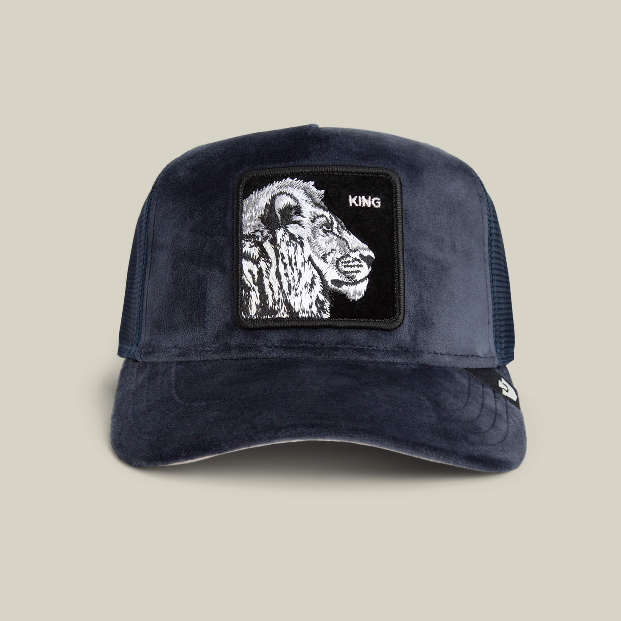 The Goorin Bros. Velour Lion hat in EDGE is a luxury cap with a mesh back, velour lion head, and KING patch on the front.