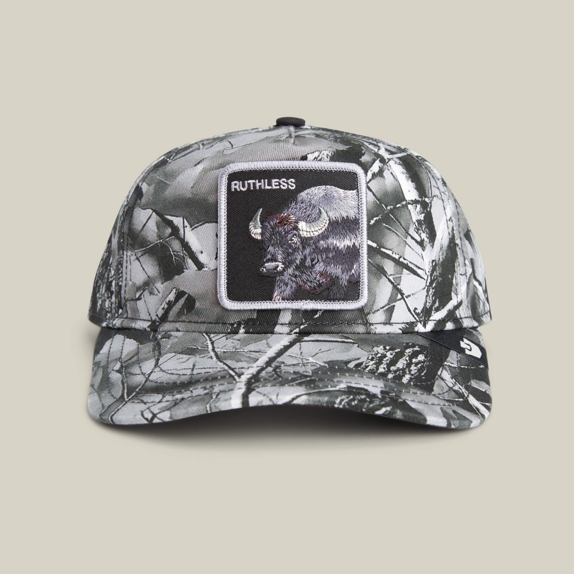 Front view of the Goorin Bros. Ruthless Camo baseball cap in monochrome camo, featuring a patch with a buffalo and "RUTHLESS" embroidered above it.