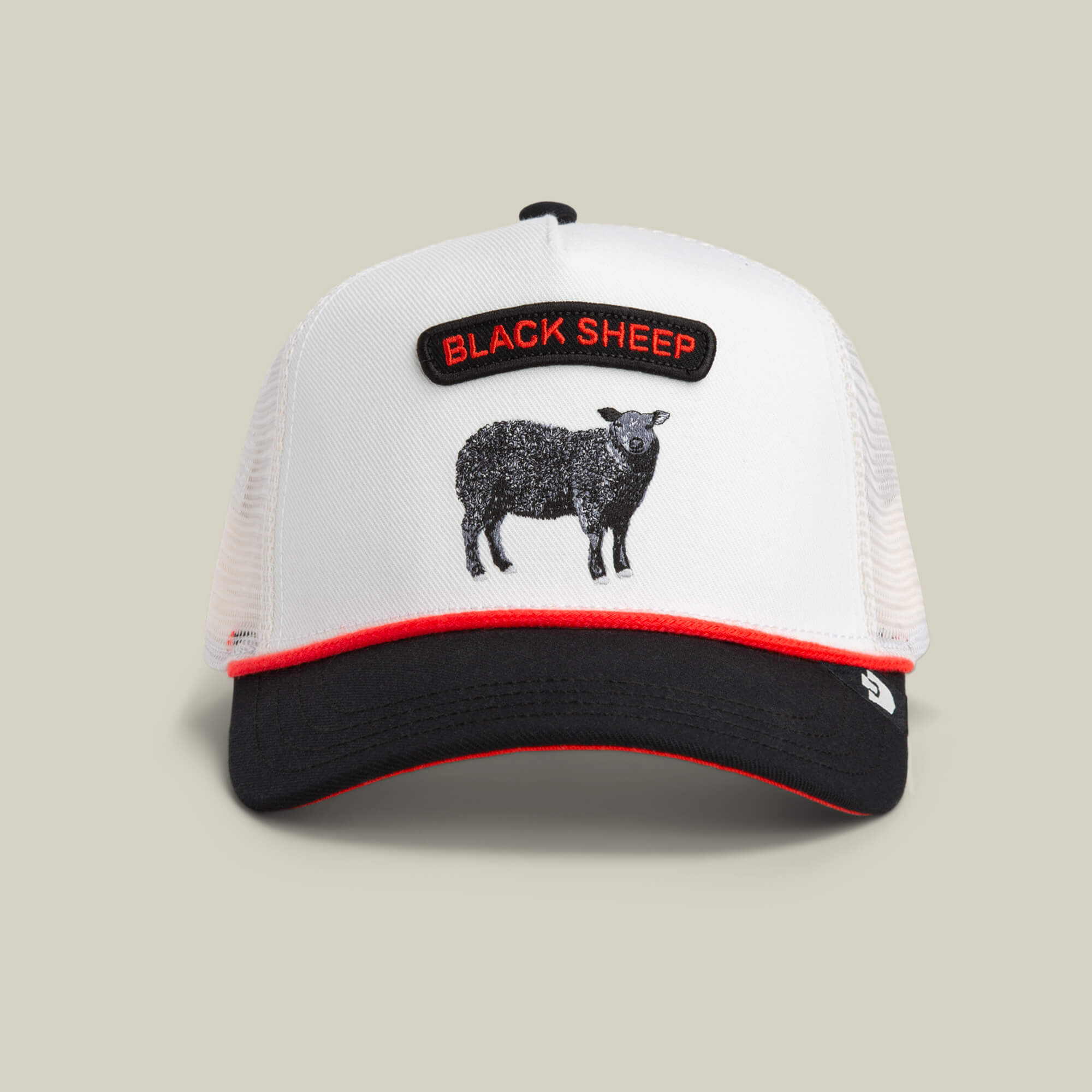 The Pop Rocker Sheep cap by Goorin Bros. is a white mesh trucker hat with a black bill, red trim, and an embroidered “BLACK SHEEP” patch above a sheep illustration.