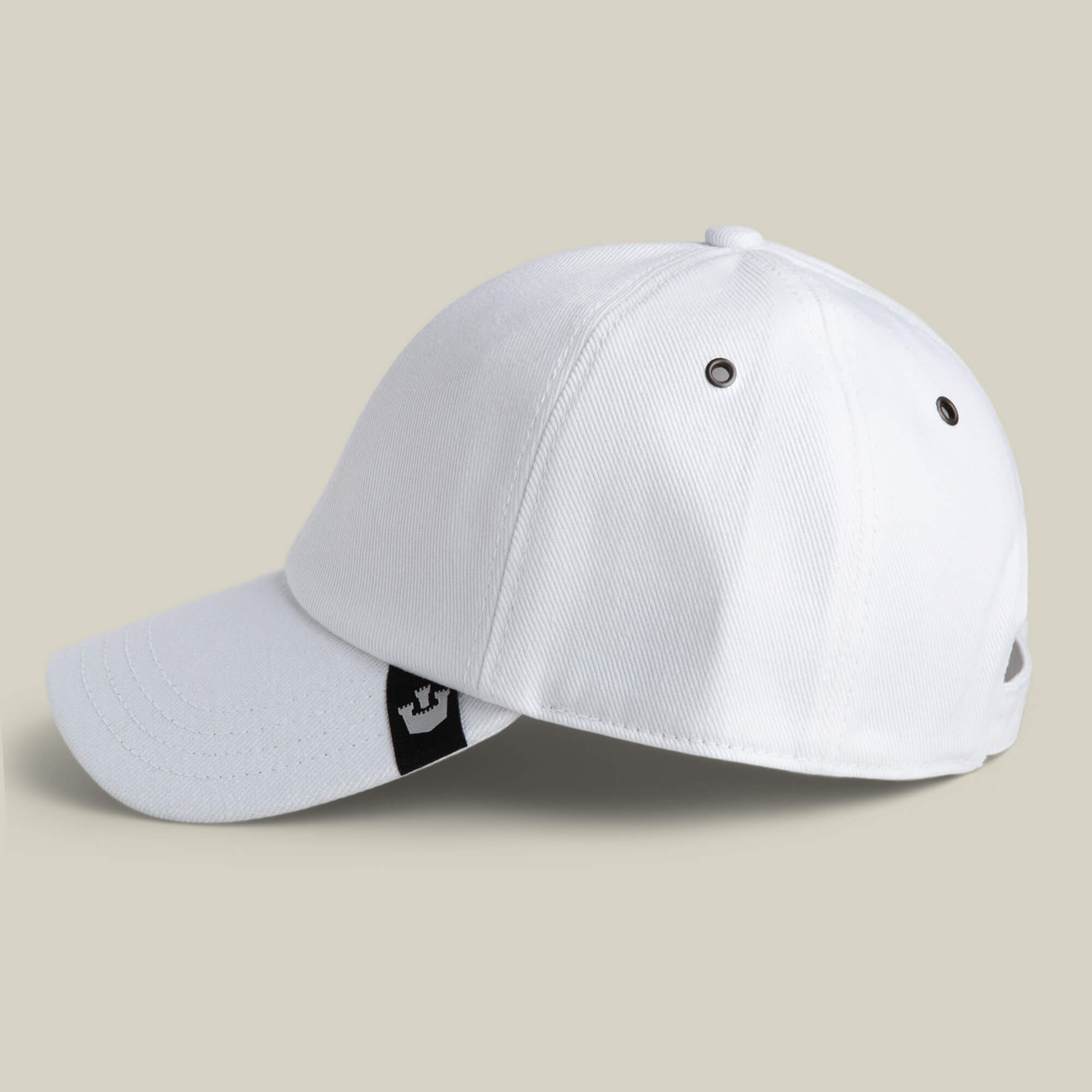 The Goorin Bros. Clean Denim Papa is a white dad cap with a curved brim, metal eyelets, and a small black and white logo tag on the side, displayed against a plain light background.