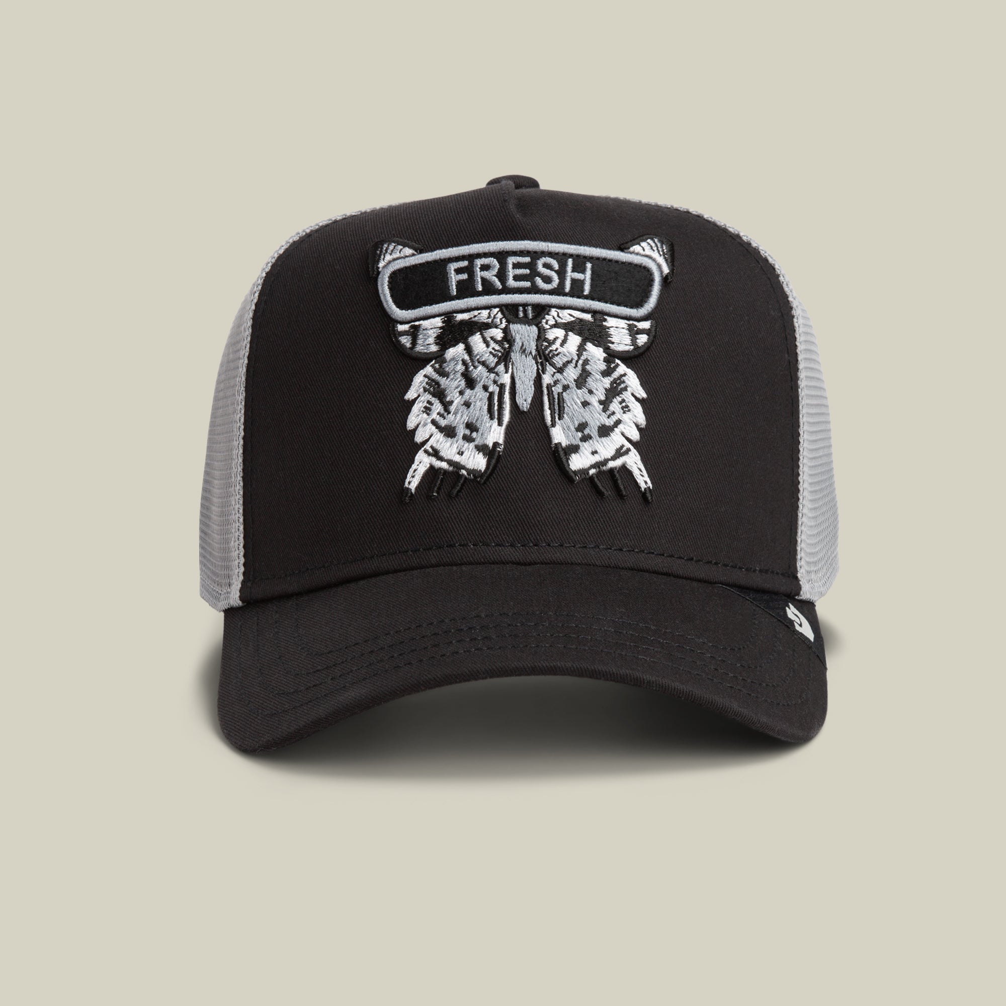 The Goorin Bros. Classic Rocker - Fresh cap in VOID features a detailed embroidered patch with wings and the word FRESH on front—a bold trucker style hat that completes your night mode look.