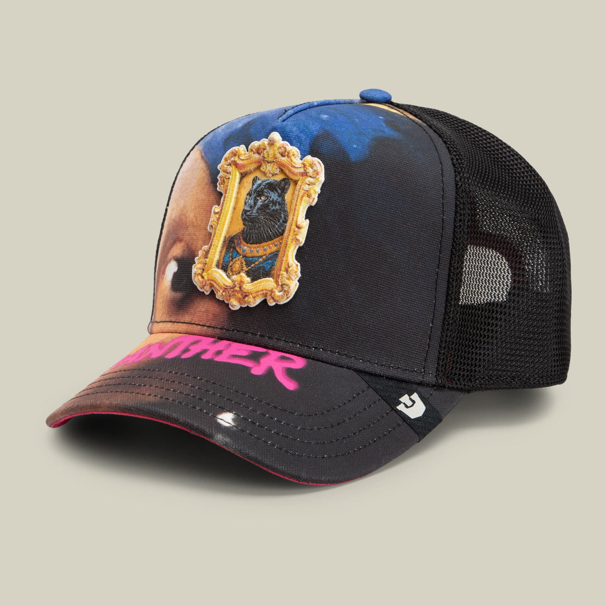 The Girl with the Pearl Necklace trucker hat by Goorin Bros features a black mesh back panel, blue and pink gradient front, embroidered portrait patch in an ornate gold frame, and pink text on the bill, displayed against a neutral background.