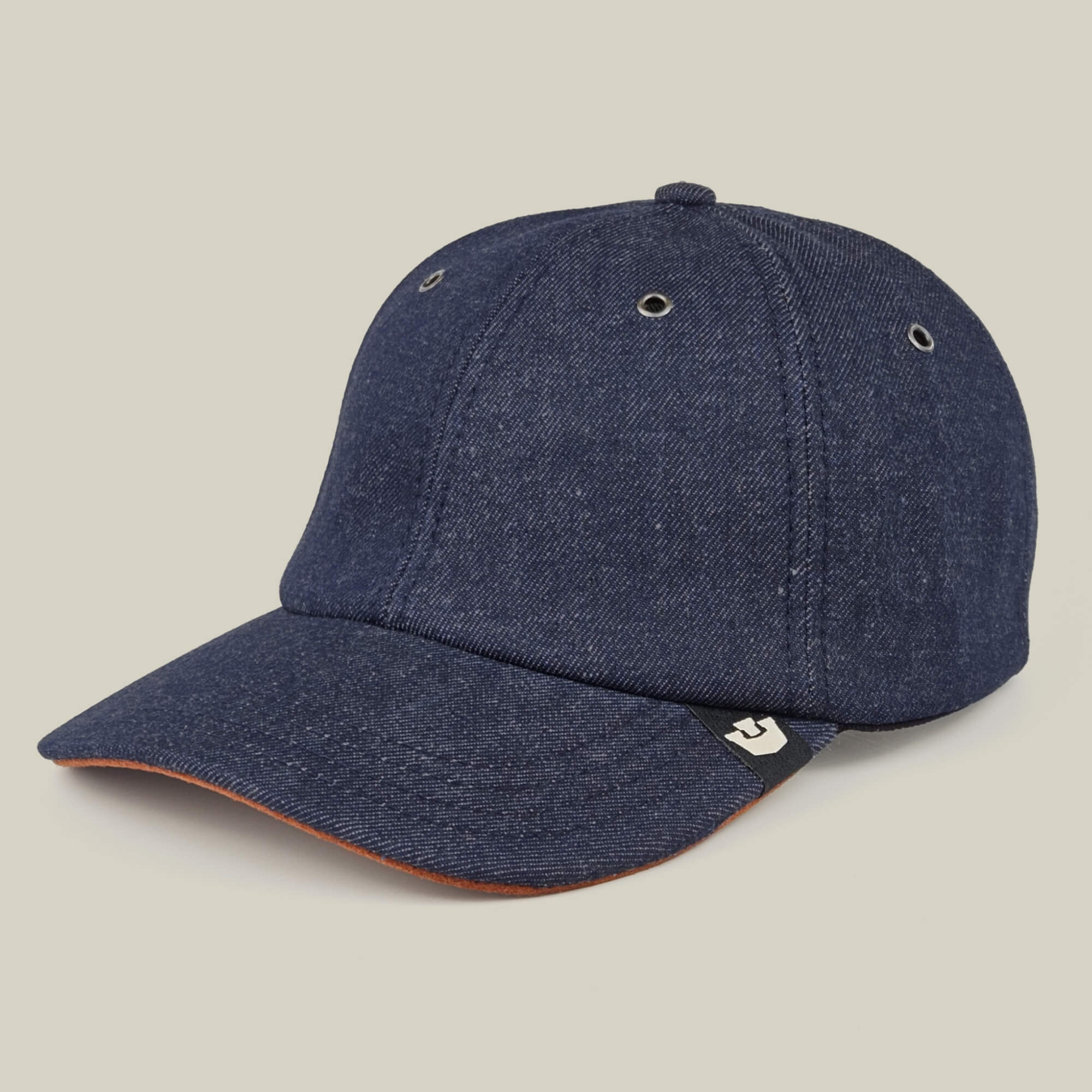 The Goorin Bros. Legend Ridge is a dark blue denim baseball cap featuring a curved brim, ventilation eyelets, and a small black and white side tag, shown here against a neutral background.
