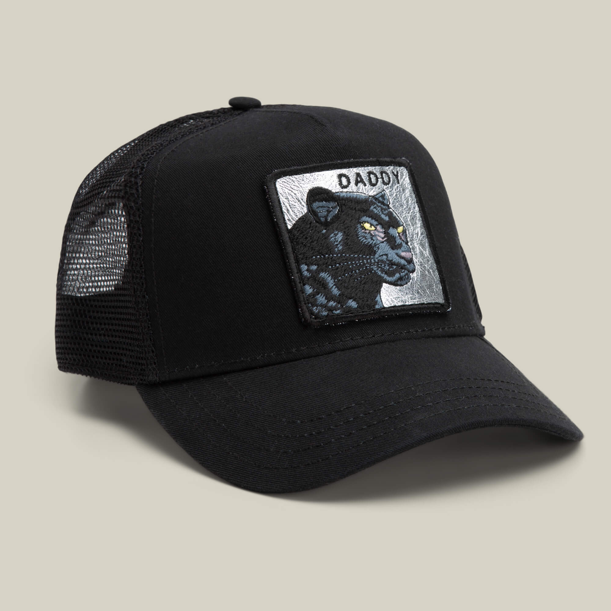 The Daddy Panther trucker hat by Goorin Bros. features black mesh, a front patch with a platinum panther and the word "DADDY," all displayed on a neutral background—your top-shelf accessory for standout style.