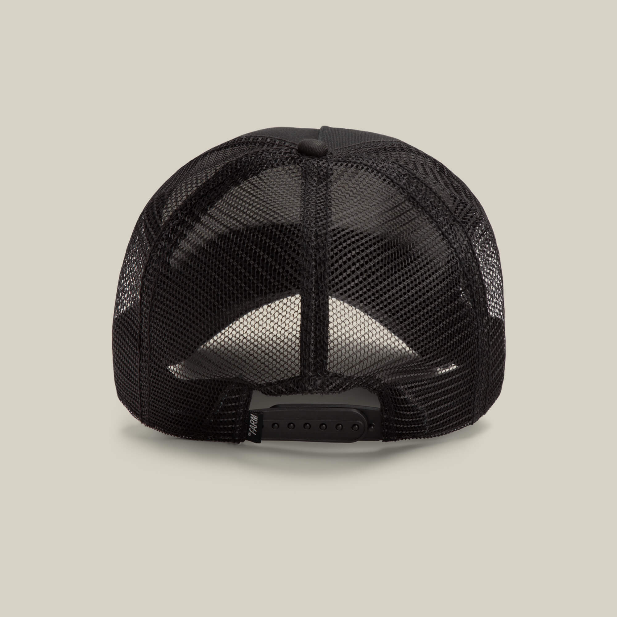The Goorin Bros. Daddy King black mesh trucker hat is shown from the back, highlighting its adjustable snapback closure and "Daddy King" detail. This limited edition piece appears against a plain beige background.
