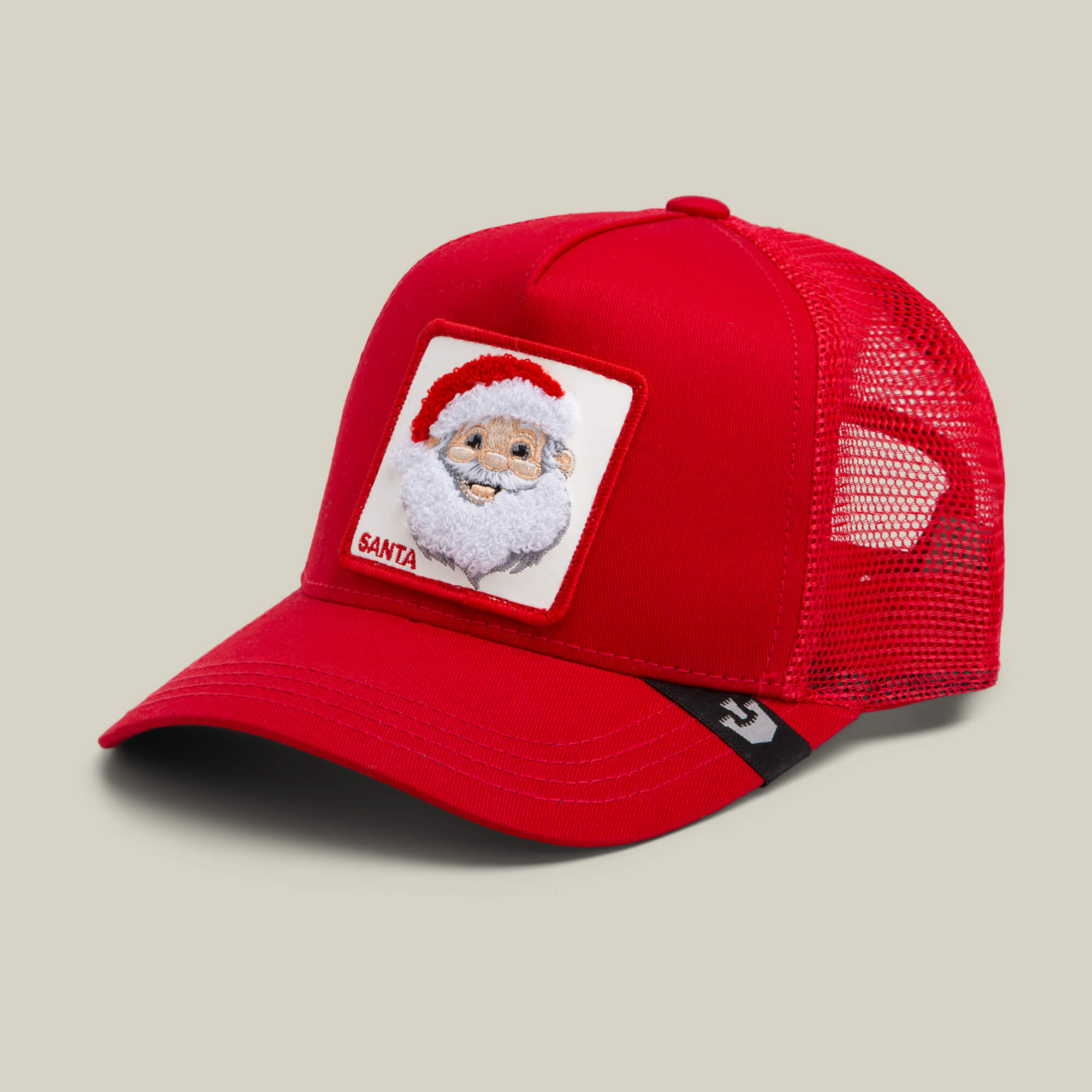 The "Mr. Claus" red mesh trucker hat by Goorin Bros. features a front patch with an embroidered Santa Claus in his classic hat and white beard—ideal for spreading holiday cheer.