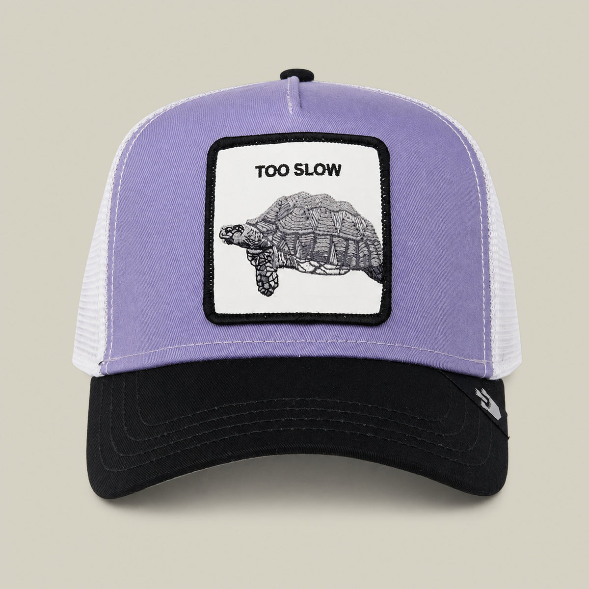 A Lavender Purple trucker cap from Goorin Bros. called “Down Low...” features a patch with a turtle and the words TOO SLOW on the front—an elusive drop that serves as a true badge of honor for any collection.