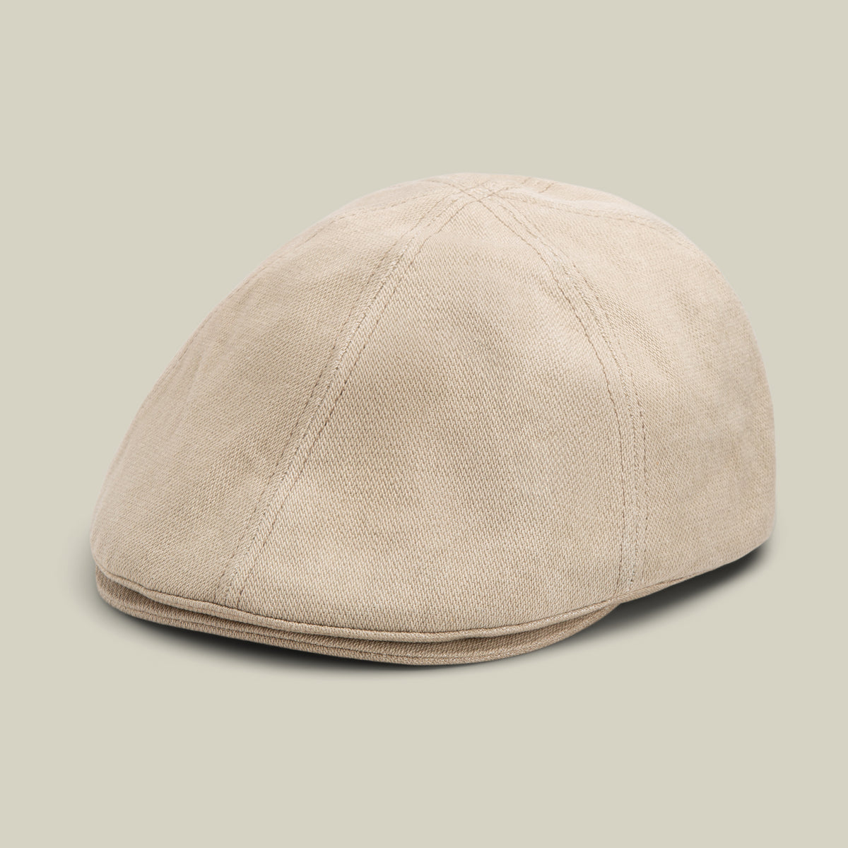 BISCUIT-colored Noisy Benjamin Paul 6 panel flatcap by Goorin Bros., crafted from textured fabric and displayed against a plain light background.
