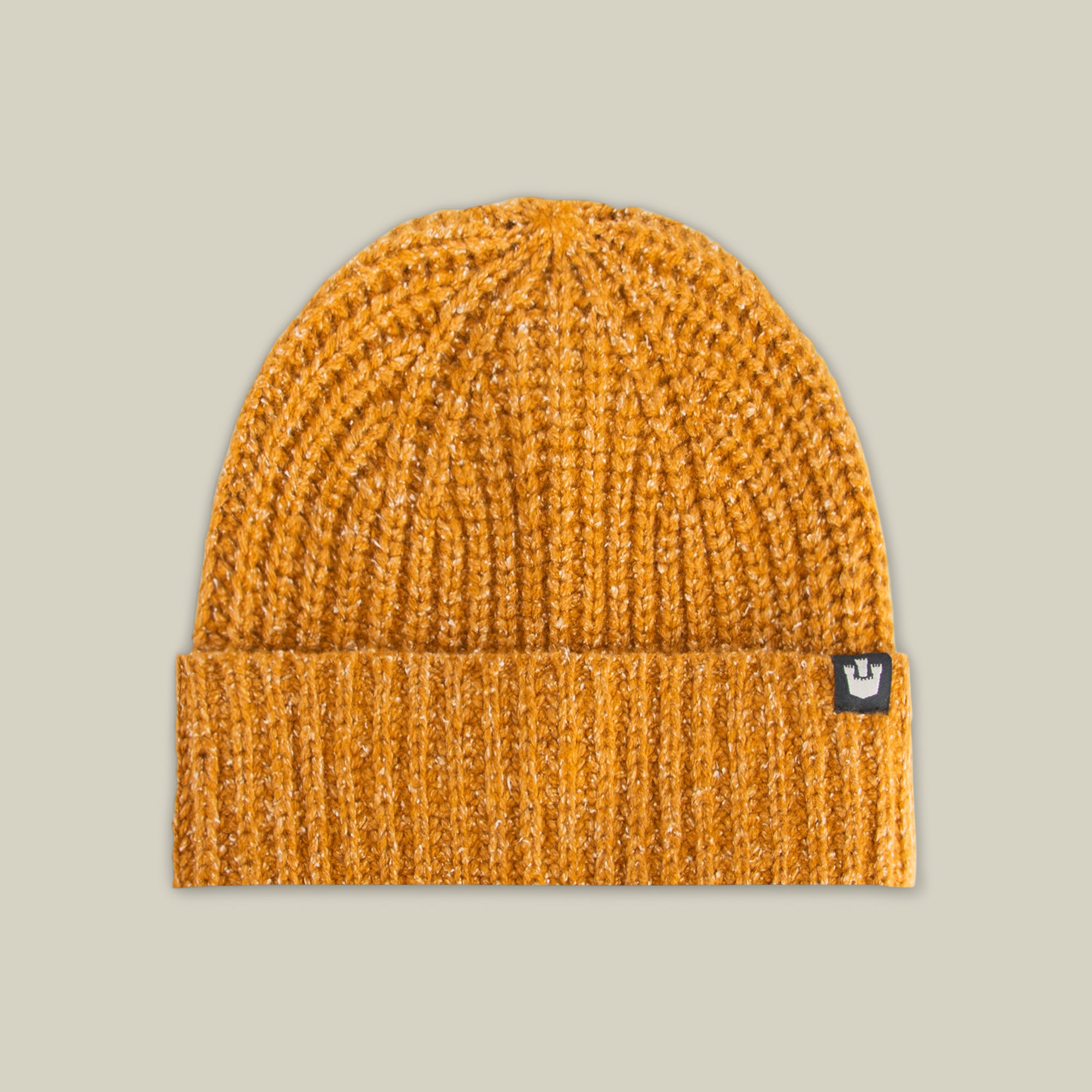 The Goorin Bros. Northstar is a luxurious mustard yellow knitted beanie with a folded brim and a small black tag featuring a white crown logo.