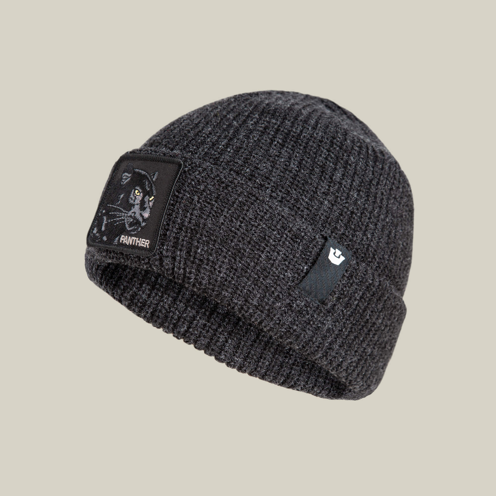 The Black Panther Beanie by Goorin Bros. is a dark gray-black knit hat with a bold panther patch and text, plus a small black side label featuring a white logo.