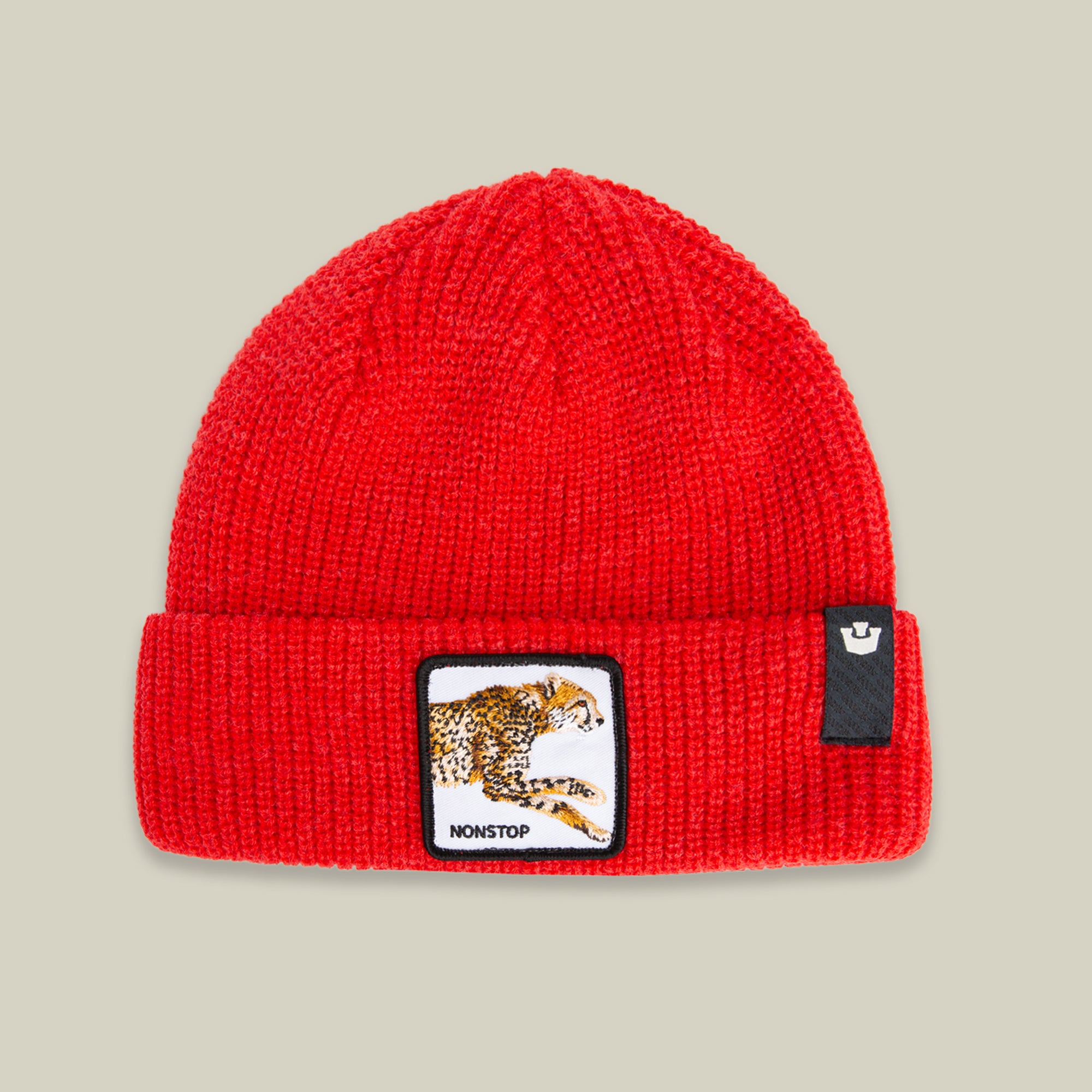 The Nonstop Beanie by Goorin Bros. in RUSH features a running cheetah patch with "NONSTOP" on the front and a small black cuff label—an essential winter hat for those always on the move.