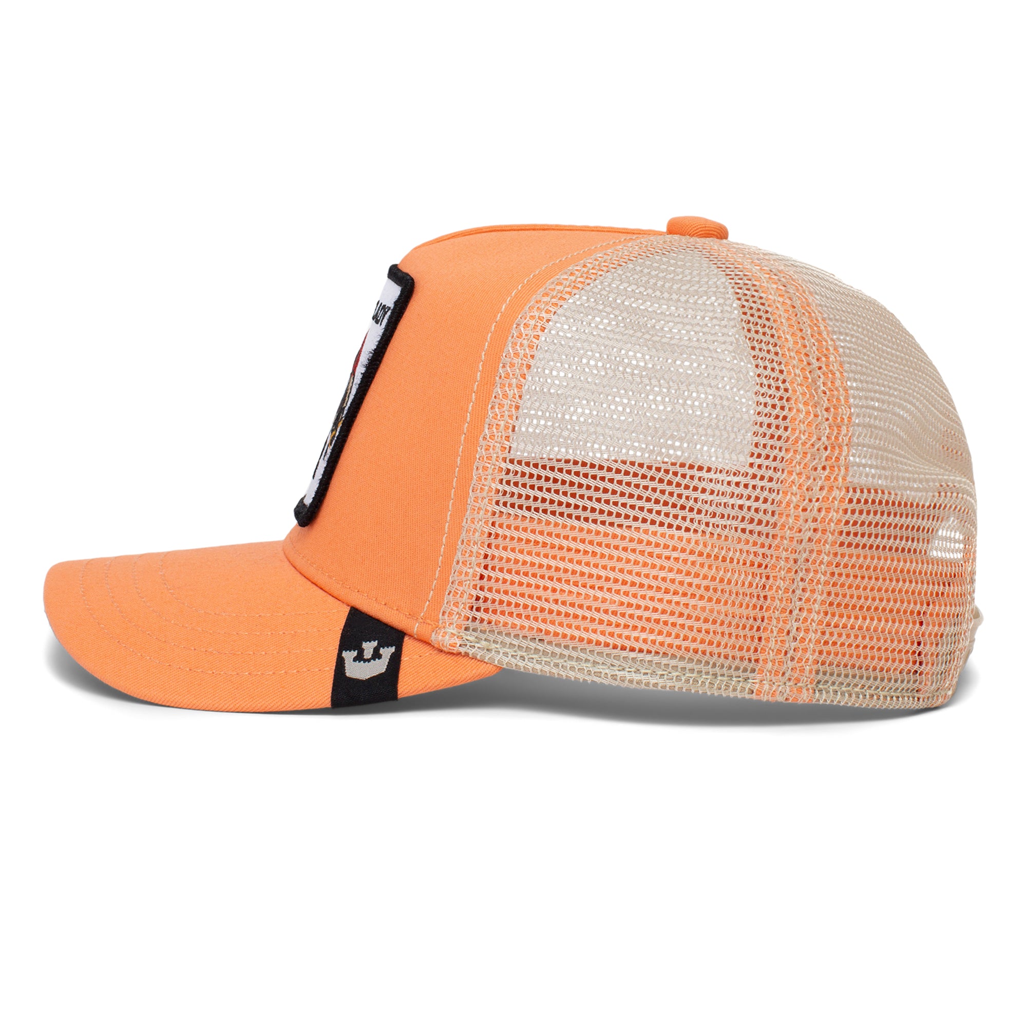 The Farm's Little Lady trucker hat, shown from the side, features orange and white mesh, a flat bill, and a rectangular patch on the front—perfectly sized for kids ages 4-10.
