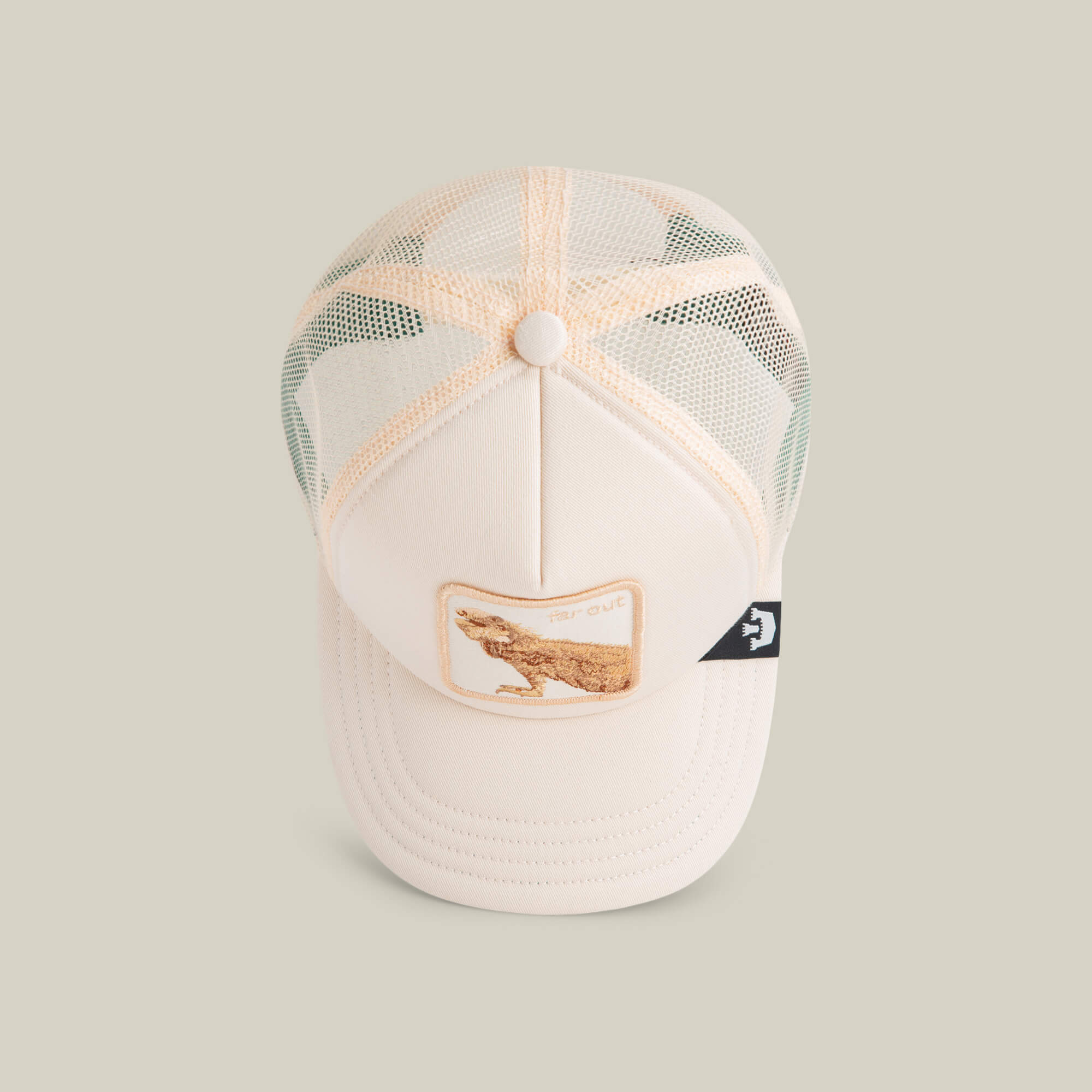 The Goorin Bros. Lil Far Out is a cream-colored mesh kids cap with a breathable design, an embroidered lizard patch on the front, and a small black side tag.