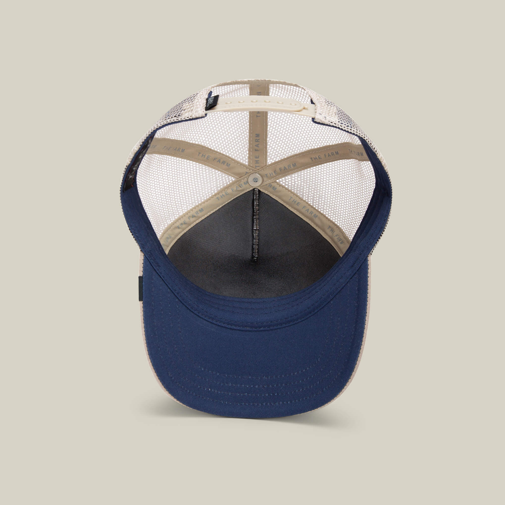 The Goorin Bros. OK Zoomer is a navy blue and beige mesh hat, shown from the underside to highlight the inner stitching and sweatband—ideal for kids or anyone who loves a classic cap.