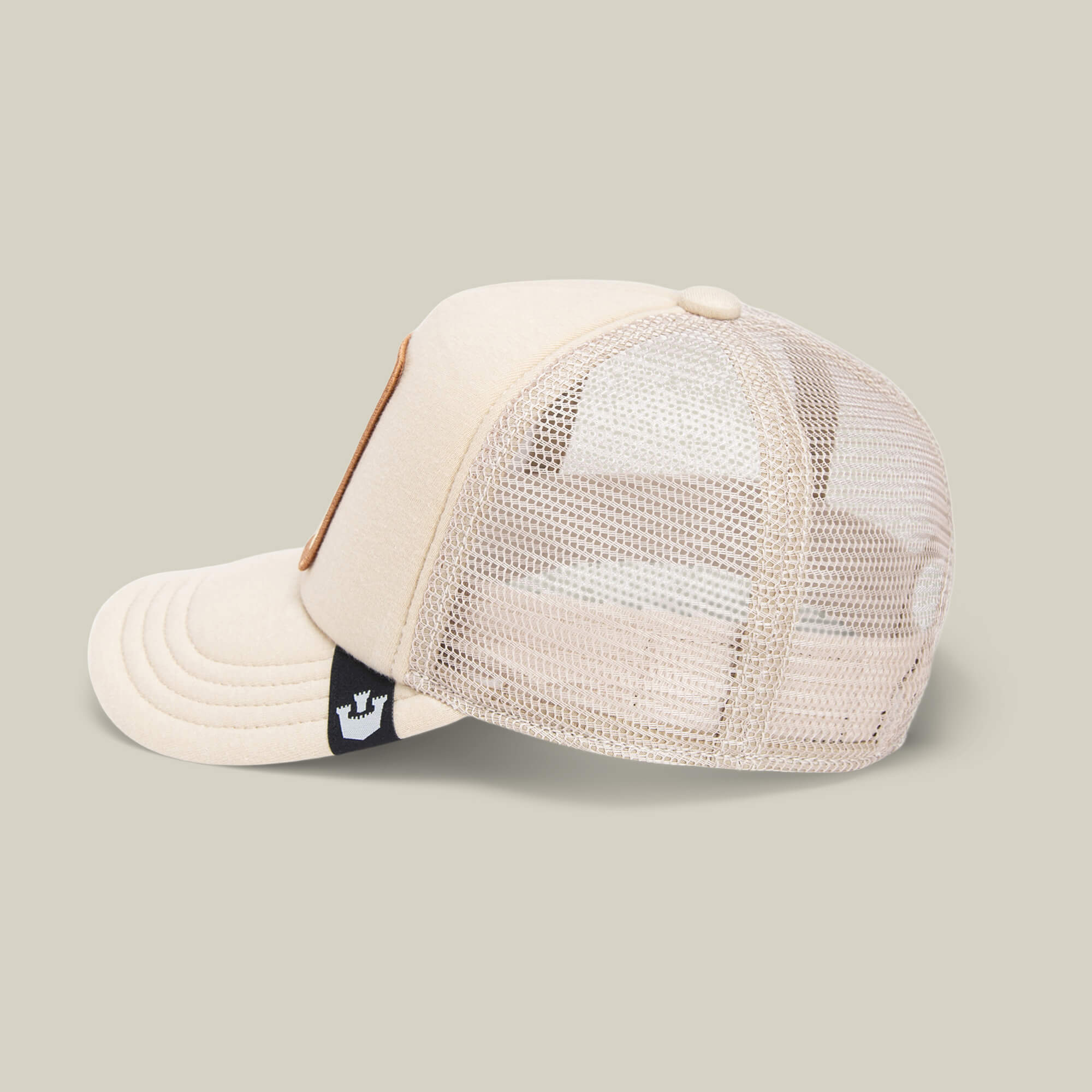 Cuddle Time kids cap by Goorin Bros. features beige and white colors, a mesh back, side logo tag, and curved brim—perfect for everyday comfort.