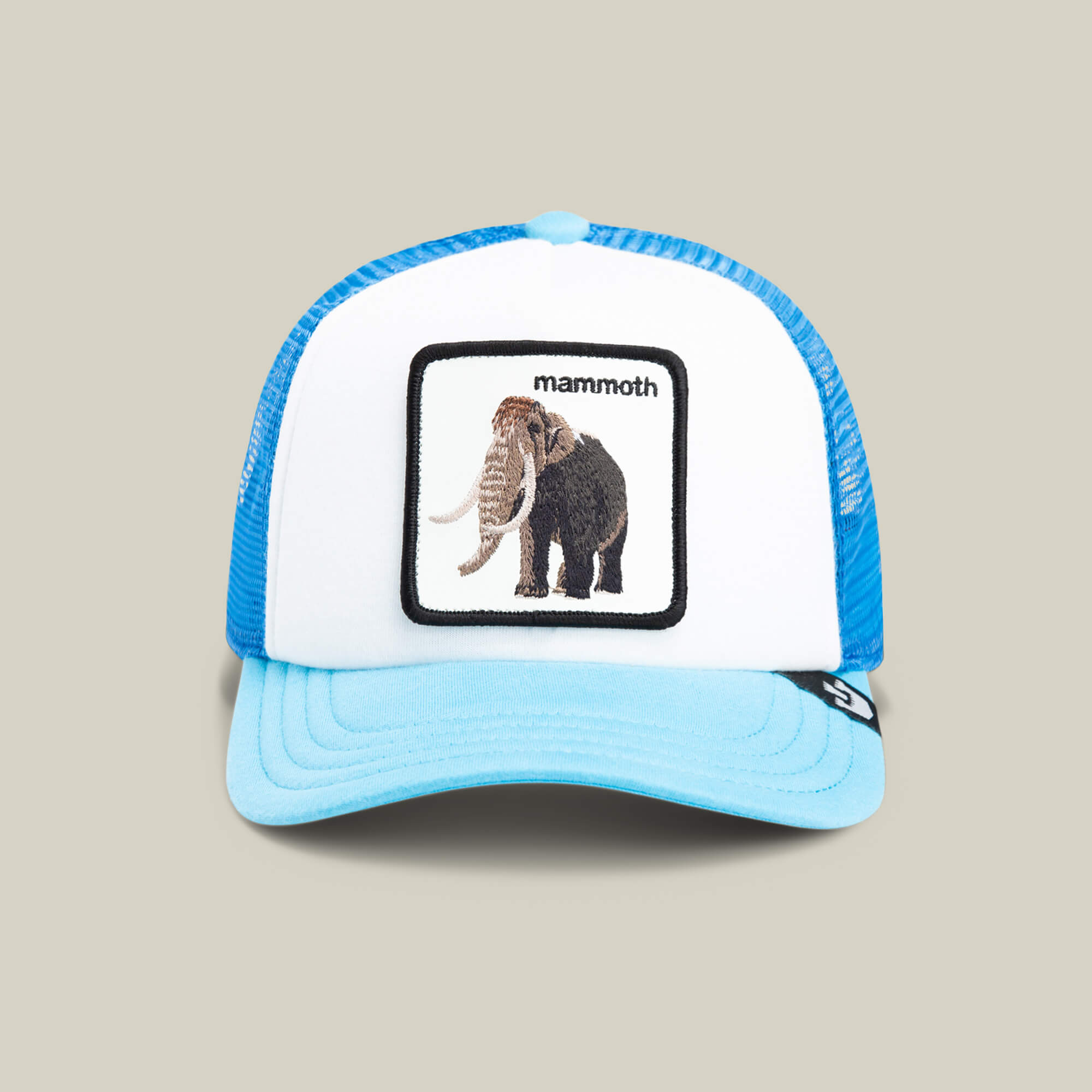 The Goorin Bros. Mammoth Kiddo is a blue and white trucker hat for kids, featuring an embroidered woolly mammoth patch with "mammoth" above it—the perfect adventure hat for young explorers.