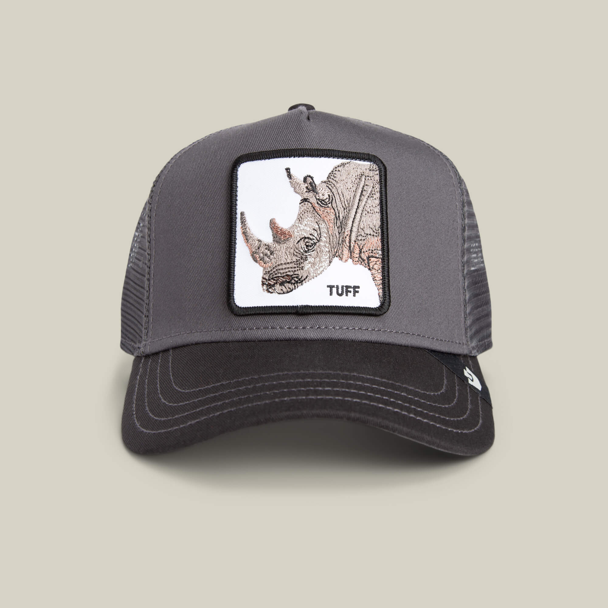 The Tuff Rhino Mini by Goorin Bros. is a gray and black mesh trucker hat with a charcoal crown, featuring a rhino patch and "TUFF" on the front.