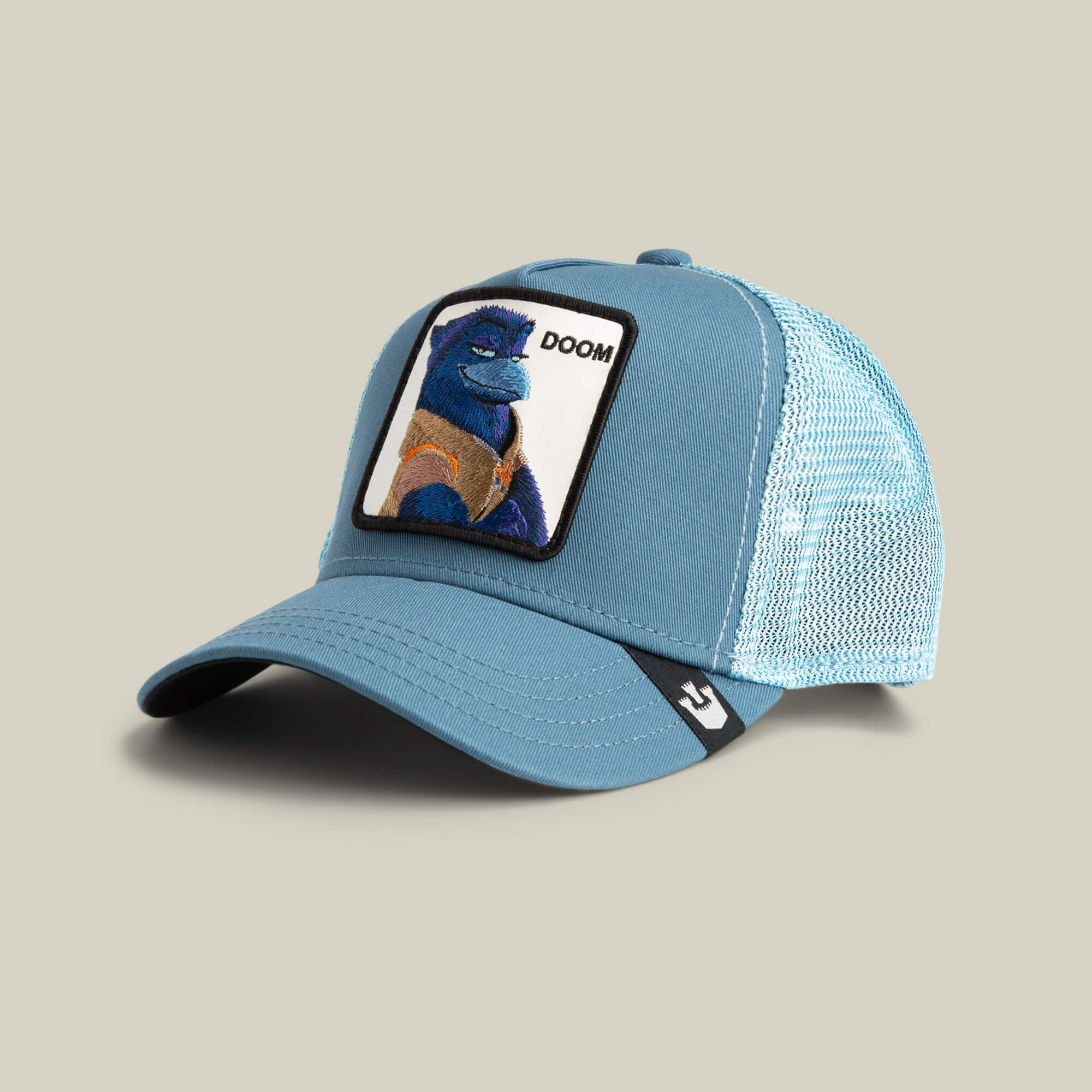 The Goorin Bros. BG2 - Doom (KIDS) is a light blue mesh trucker hat with a front patch showing a blue bear in an orange vest, "DOOM" above, and a playful aviator style for adventurous kids.