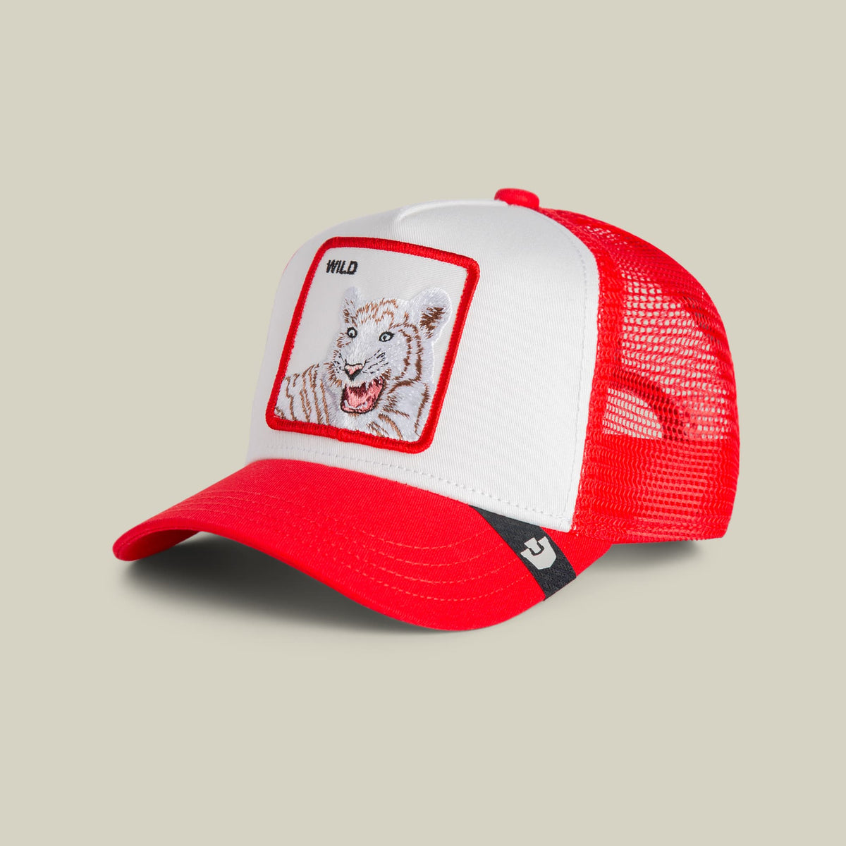 The Goorin Bros. Wild Tiger Mini trucker hat in red and white features a mesh back panel and an embroidered tiger patch with "WILD" text on the front, displayed against a neutral background.
