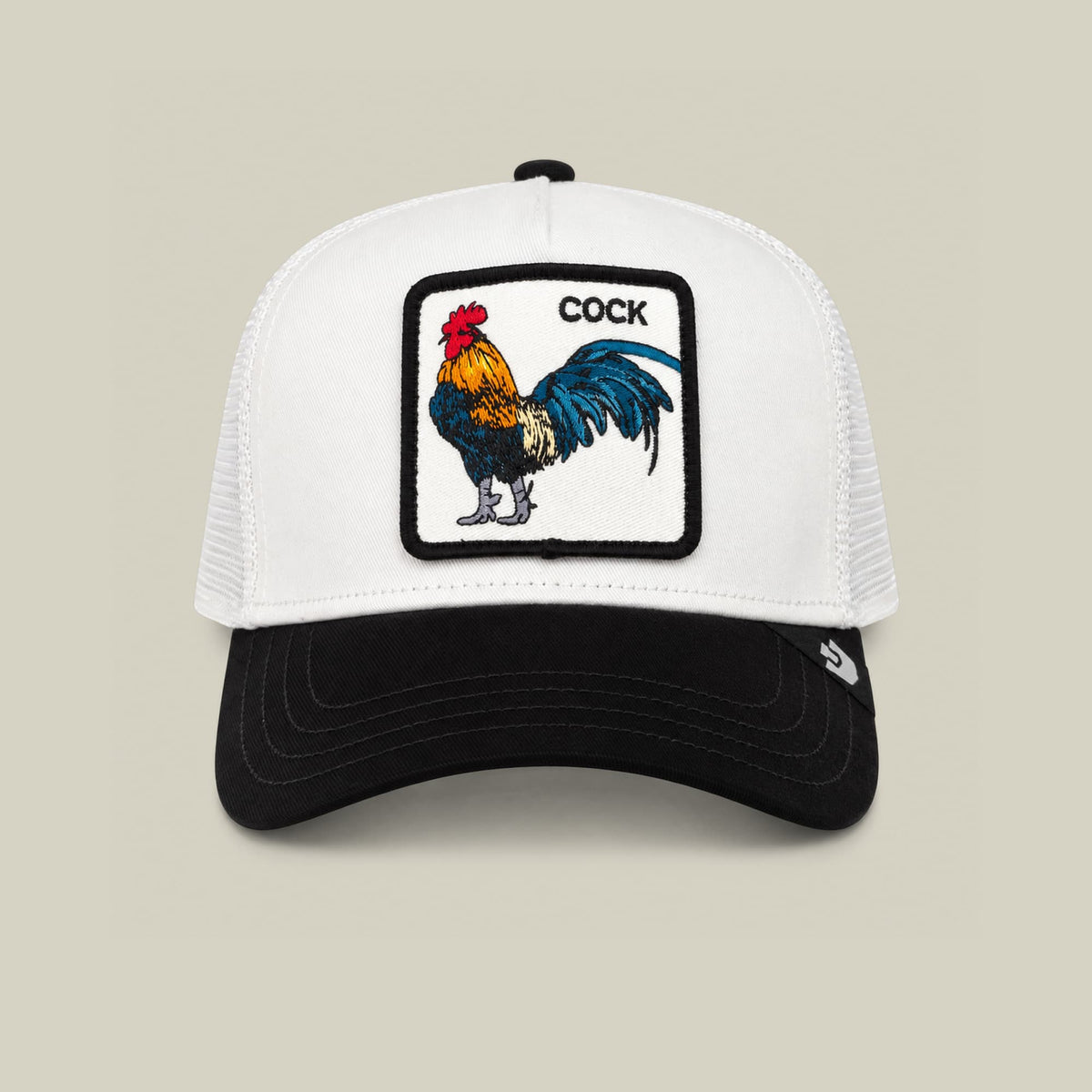 The Goorin Bros. Suede Colorful Rooster is a black and white trucker hat with a mesh back and snapback closure, featuring a colorful embroidered rooster patch on the front panel.