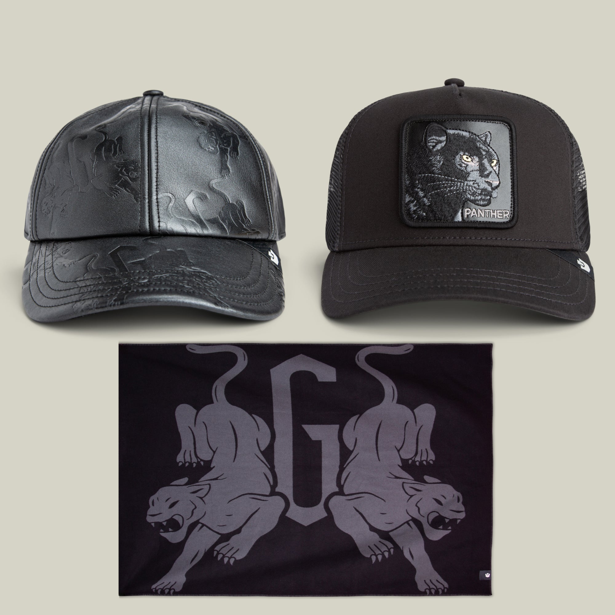 The Elite Panther Bundle from Goorin Bros. includes two black caps featuring panther designs and a black bandana adorned with two stylized panther illustrations and a prominent letter G in the center.