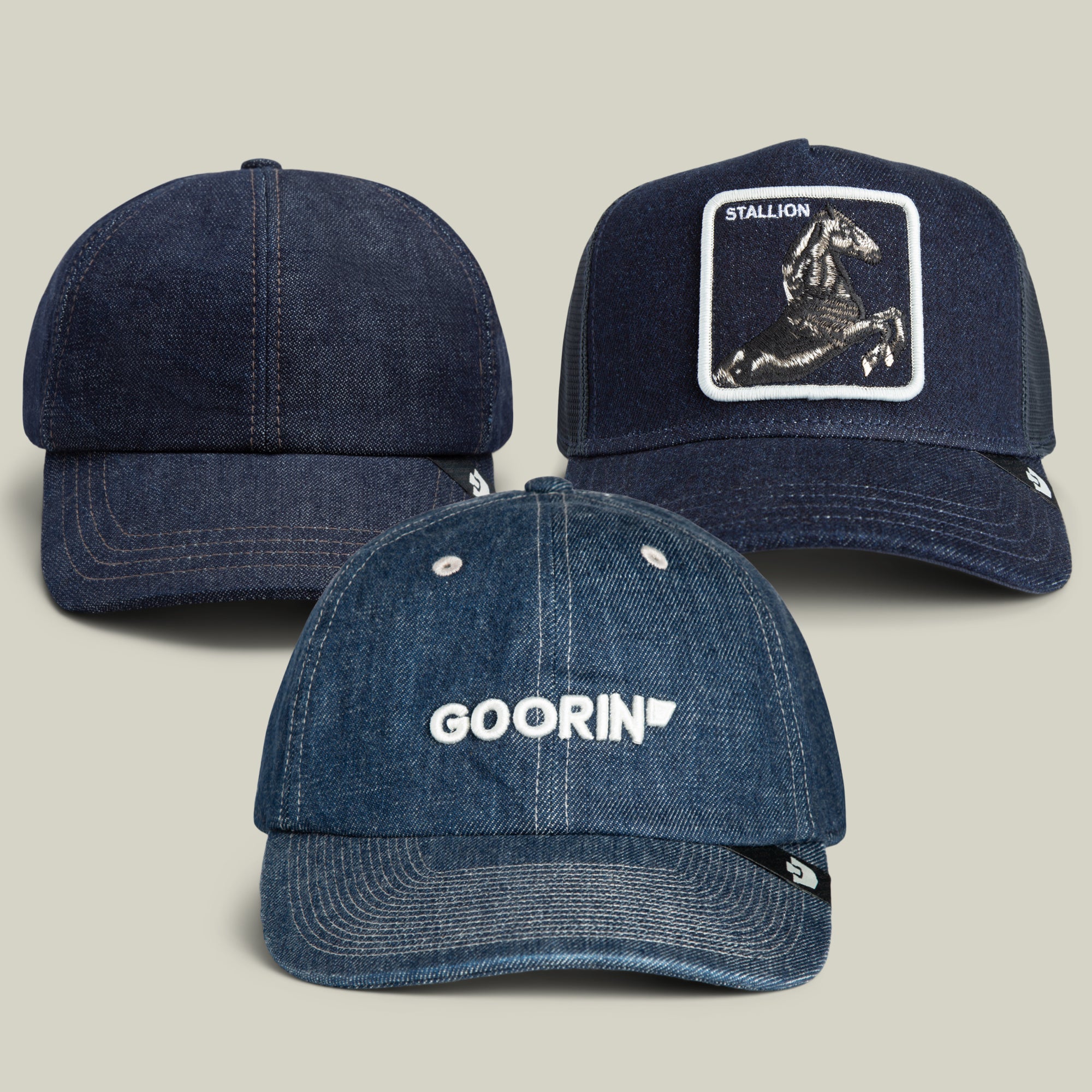 Three blue denim baseball caps from the Goorin Bros. Jorts Bundle are displayed: one featuring GOORIN text, another showcasing a horse patch labeled “STALLION” for a vintage Mom Jeans vibe, and one in a classic, plain design.