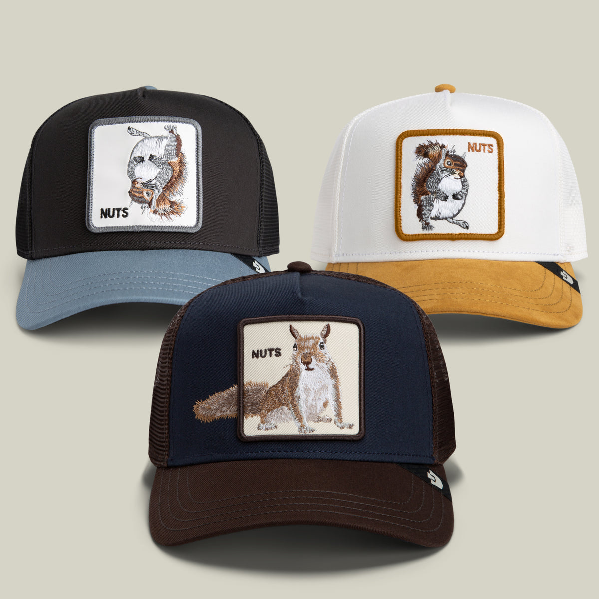 Sure! Here’s a rewritten sentence using your product data: The Nut Luvr Bundle by Goorin Bros. includes three playful trucker hats featuring embroidered squirrels and “NUTS” on the front patches; available in black, navy, and white with brown or blue brims for a quirky look.