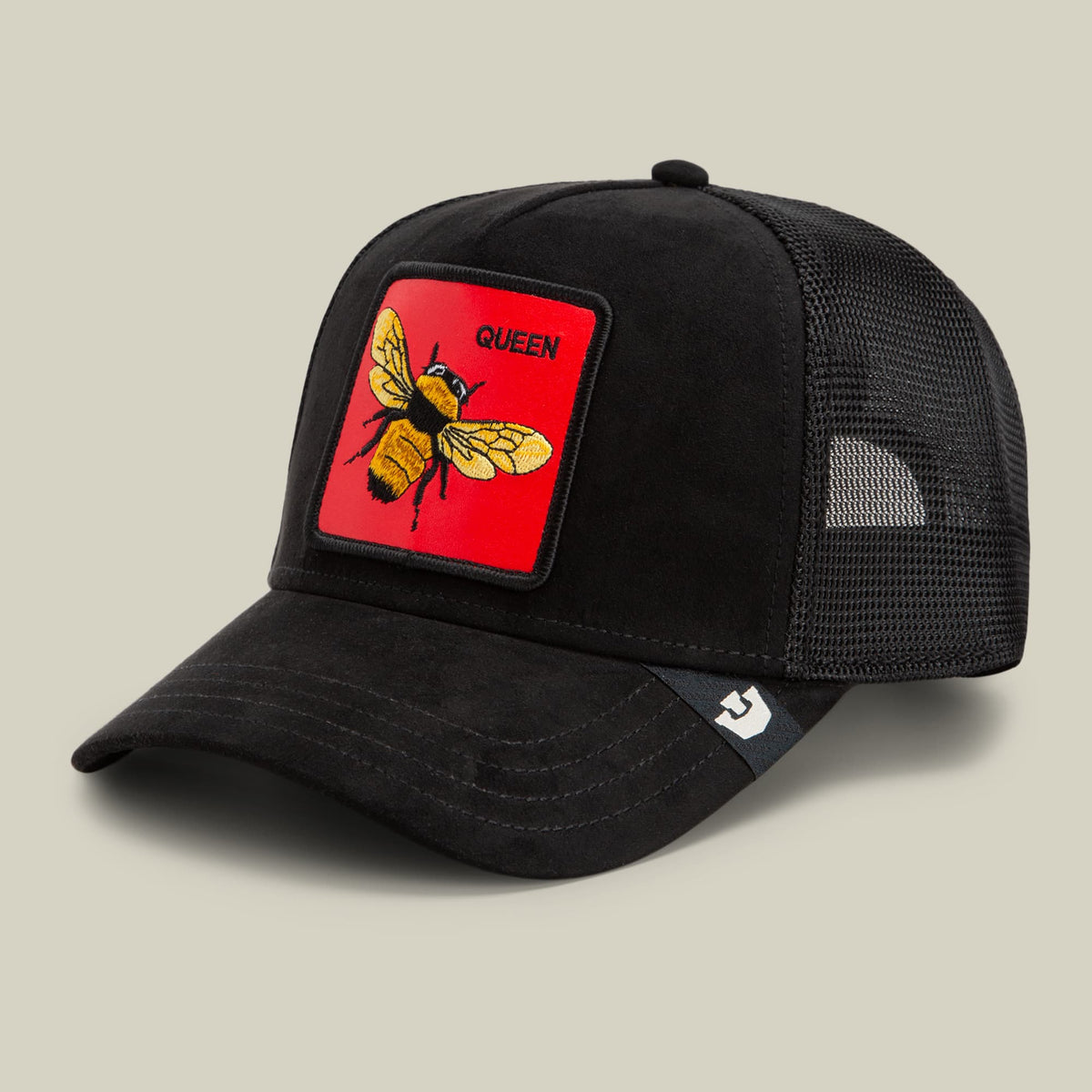 The Goorin Bros. Regina Rossa black trucker hat with mesh back features a red embroidered patch with a yellow and black queen bee and the word "Queen" on the front.