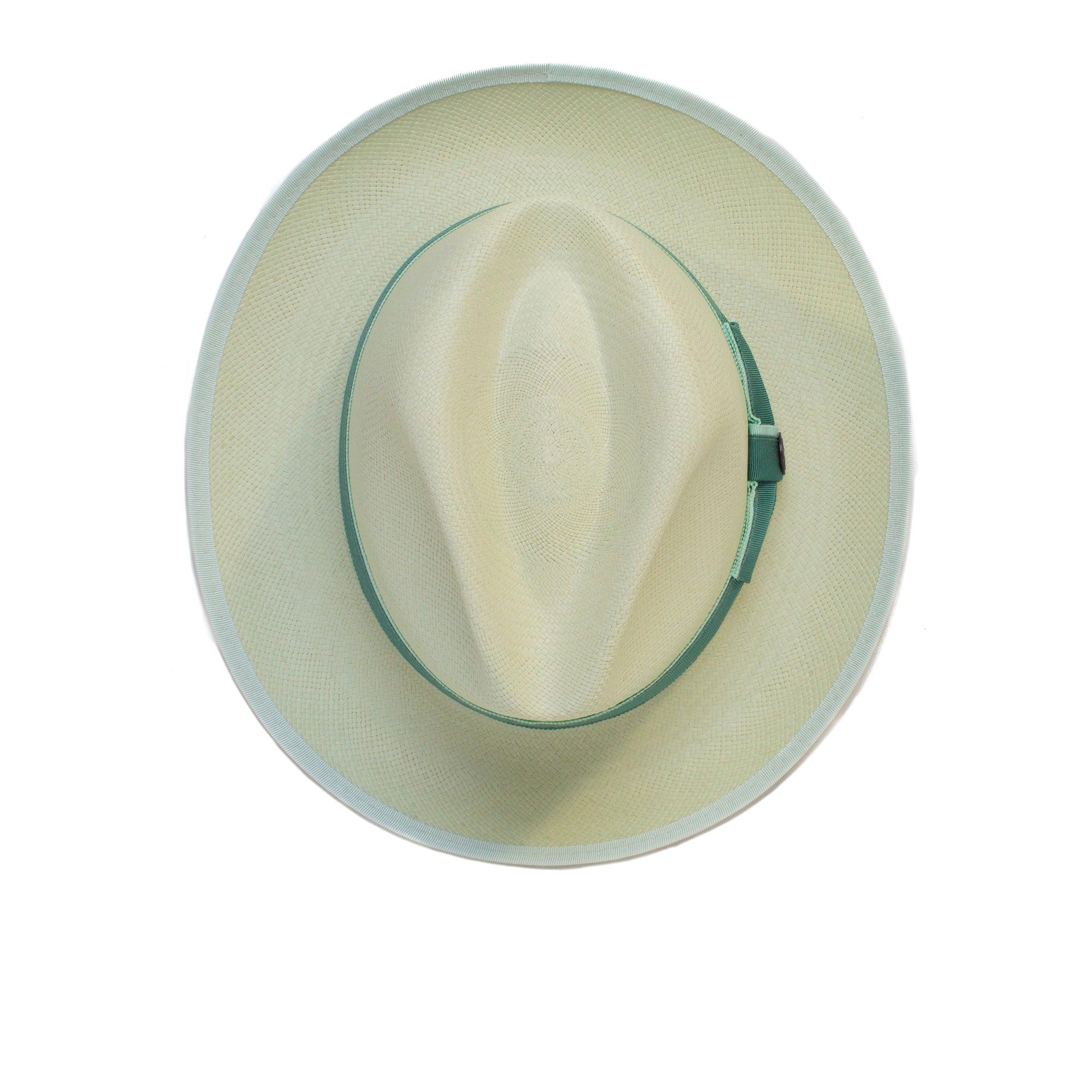 The Hartman by Goorin Bros. is a beige wide-brimmed hat featuring a green grosgrain band and contrast edge binding, shown from above on a white background.