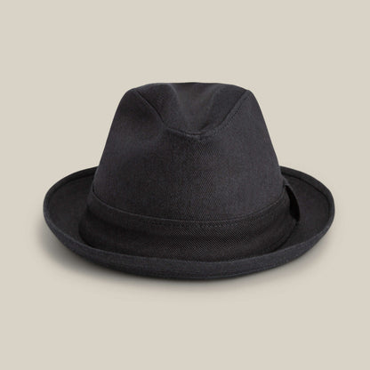 The Goorin Bros. Big Stepper is a stylish black fedora with a short brim and black band, shown on a neutral beige background.