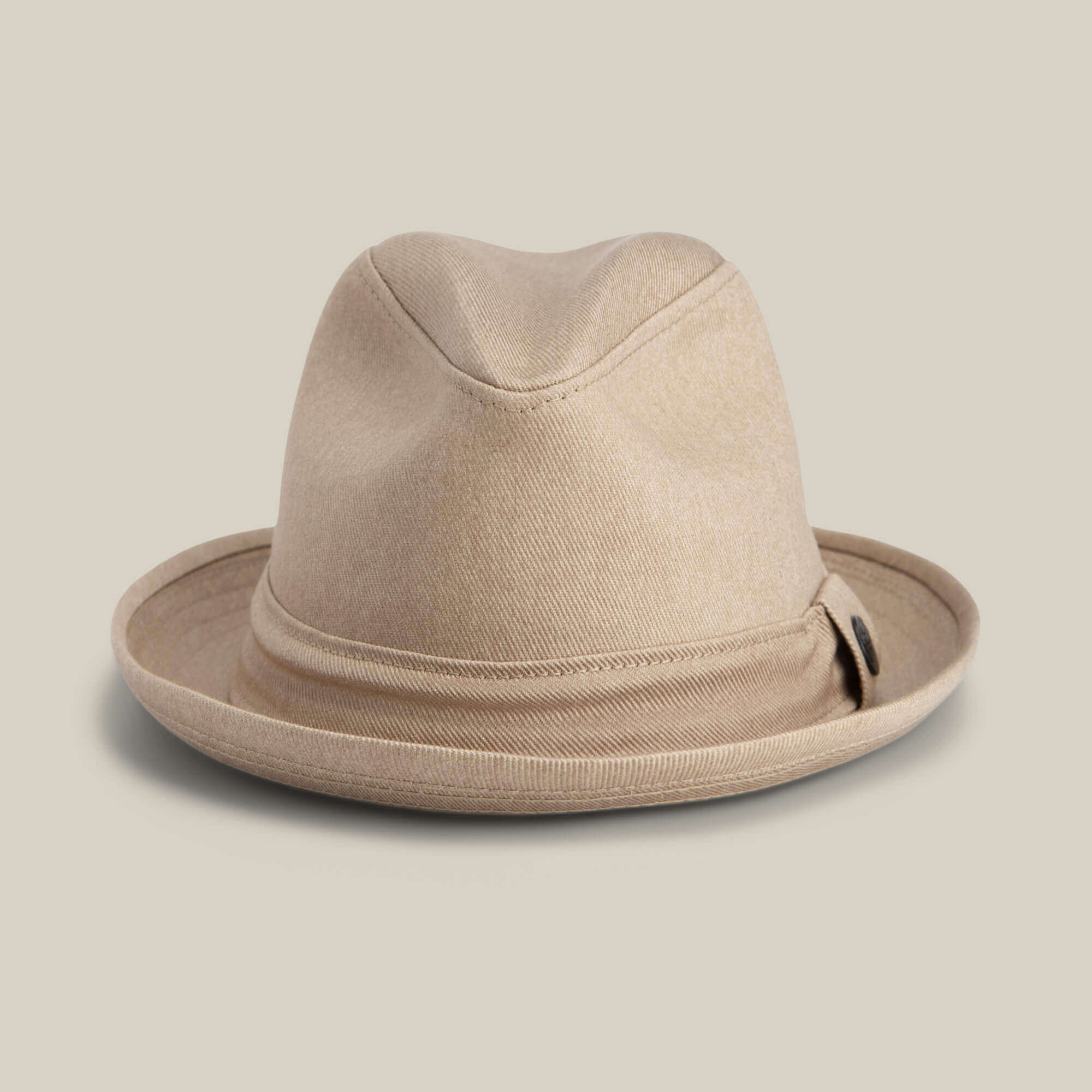 The Goorin Bros. Big Stepper is a beige fedora with a slightly creased crown and folded brim, showcased against a plain light background.