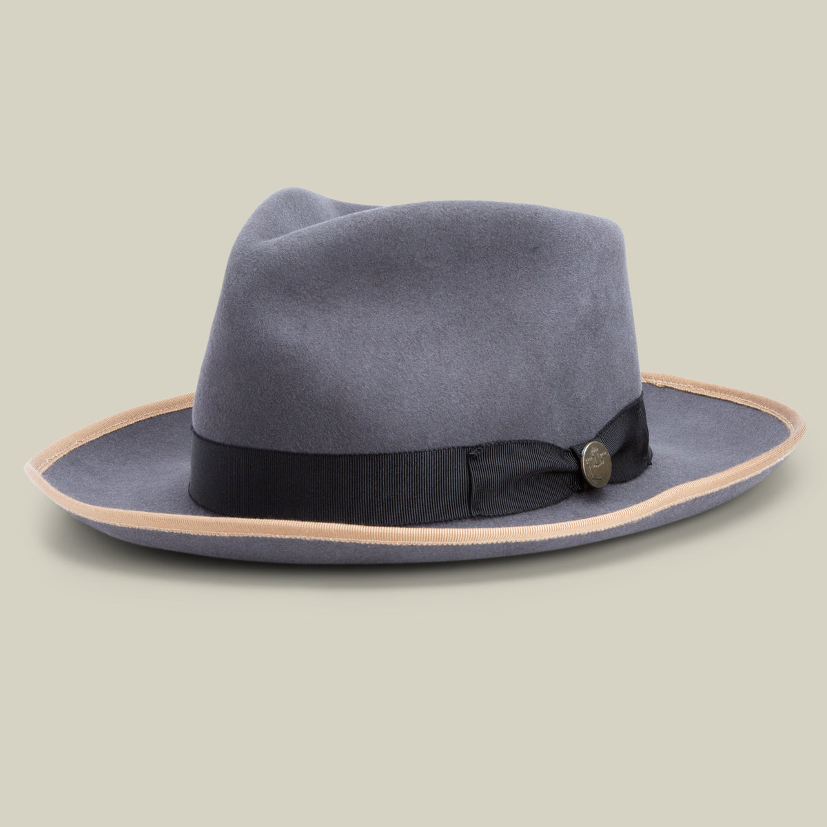 The River Gray by Goorin Bros. is a wide-brimmed fedora hat in grey, expertly crafted from premium merino wool with a black band and light brown edge, made in the USA and showcased against a neutral background.