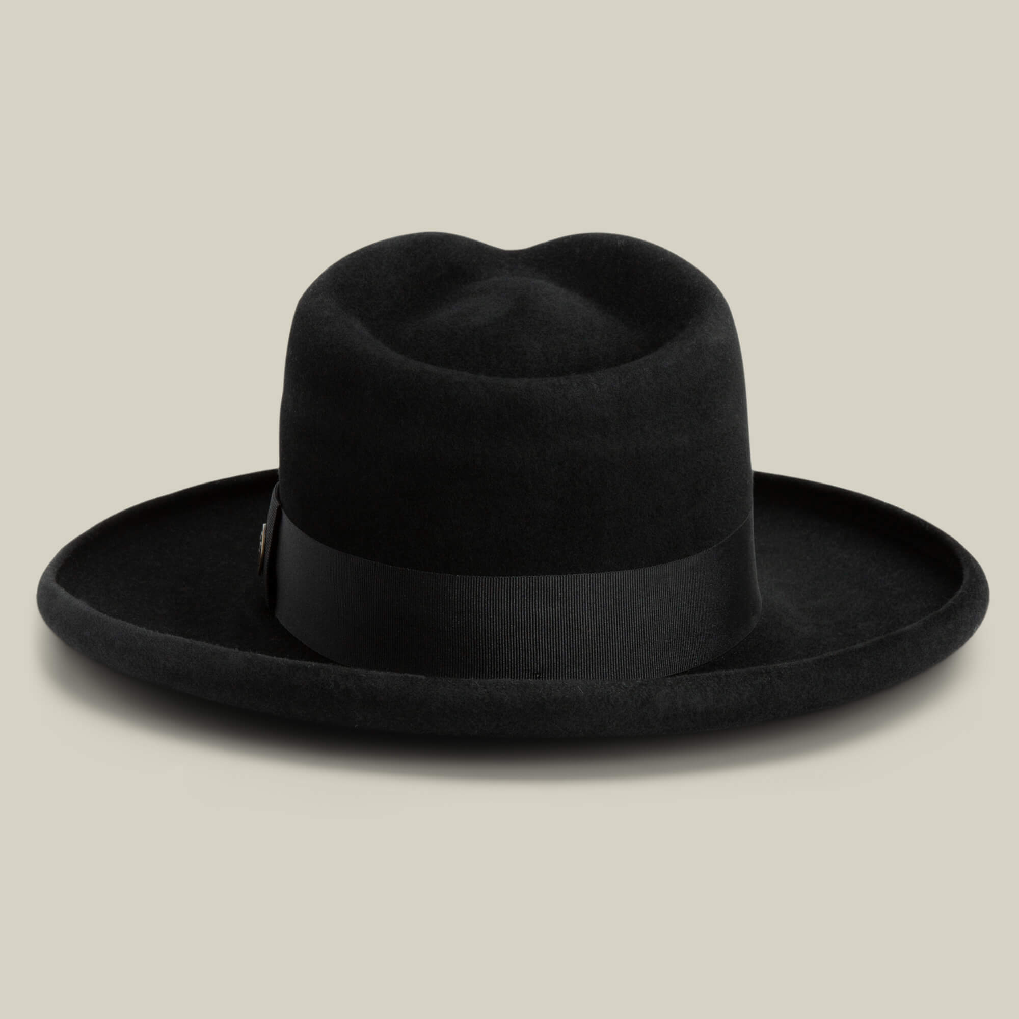 The Colonel Pierce by Goorin Bros. is a black wide-brimmed felt hat with a flat crown and matching ribbon band, shown on a neutral background.