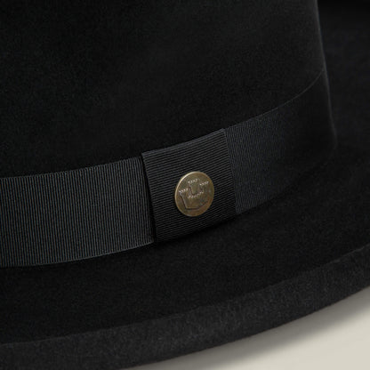 Close-up of the Goorin Bros. Colonel Pierce hat in black felt, featuring a grosgrain ribbon, small round metal pin, and a classic teardrop crown.