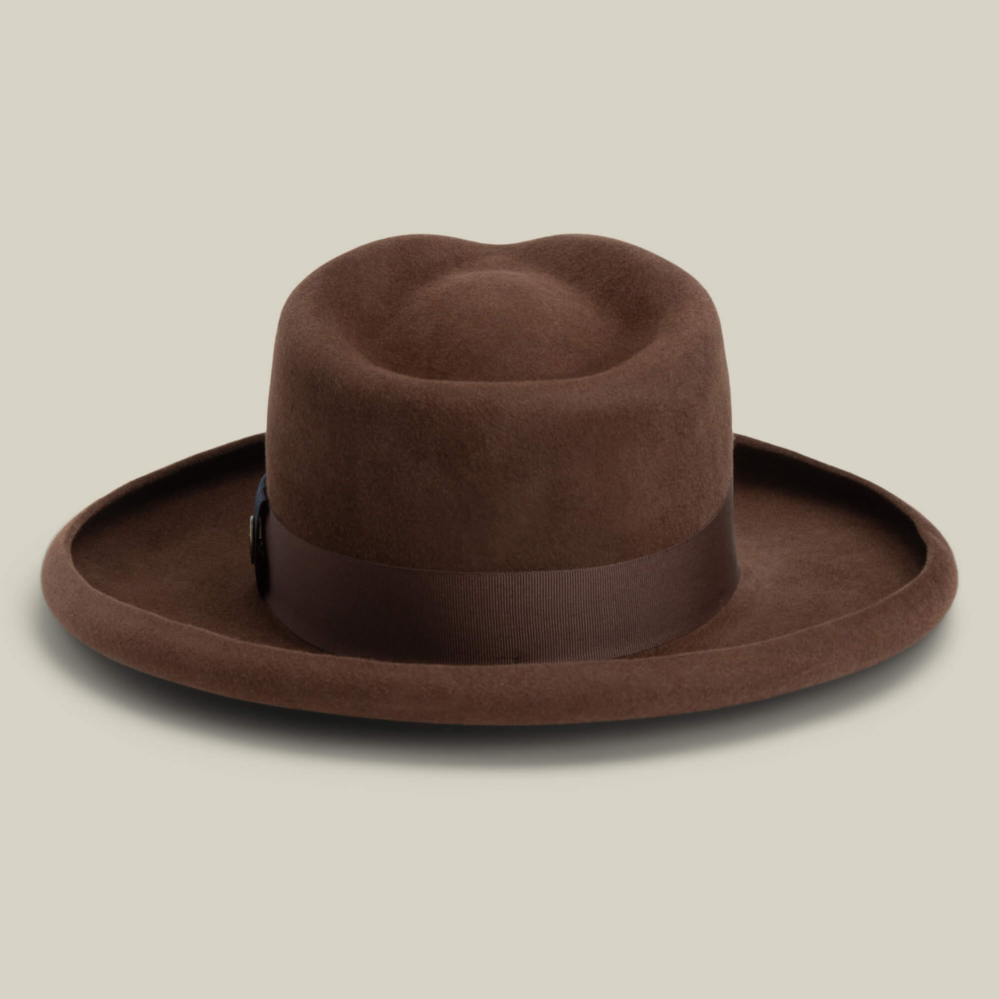 The Goorin Bros. Colonel Pierce is a brown felt hat with a teardrop crown and wide pencil curl brim, shown against a plain light beige background.