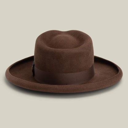 The Goorin Bros. Colonel Pierce is a brown felt hat with a teardrop crown and wide pencil curl brim, shown against a plain light beige background.
