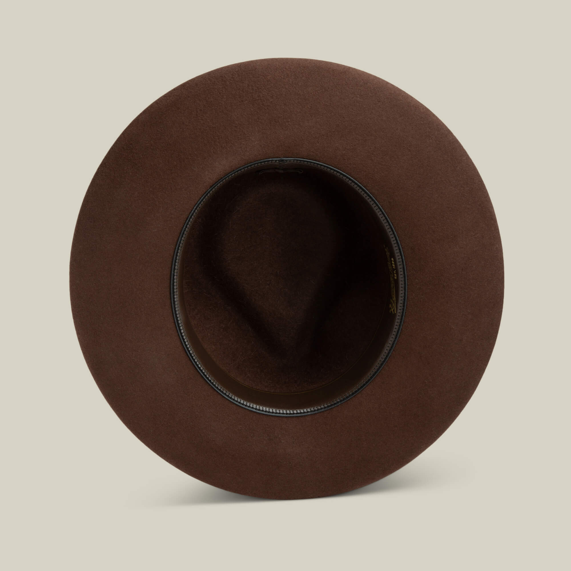 Top view of the Goorin Bros. Colonel Pierce hat in brown, featuring a teardrop crown, wide brim, and black inner band, displayed on a plain light background.