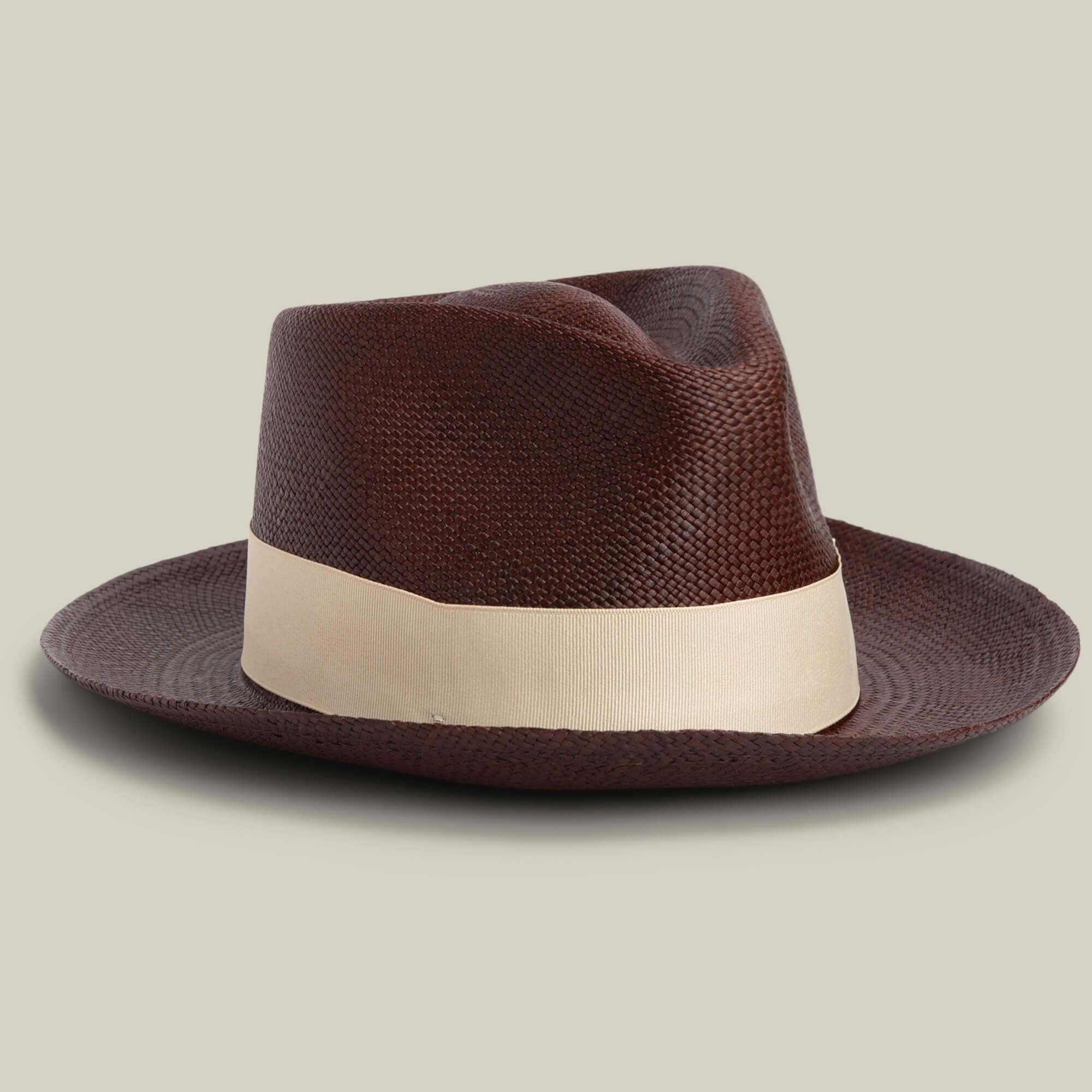 The Goorin Bros. John Sr. is a brown toquilla teardrop fedora hat with a wide, light band and 50 UPF sun protection, displayed against a plain, light background.