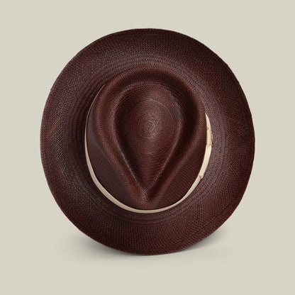 The Goorin Bros. John Sr. is a brown toquilla teardrop fedora with a wide brim and indented crown, shown from above on a light background, offering 50 UPF sun protection.