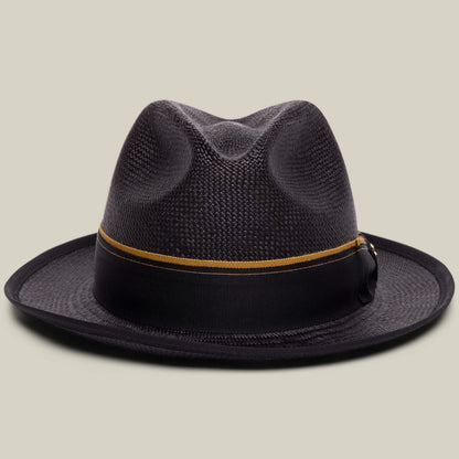 The Goorin Bros. Hartman fedora in VOID features a wide brim and a grosgrain band with a thin gold stripe, shown against a plain beige background.