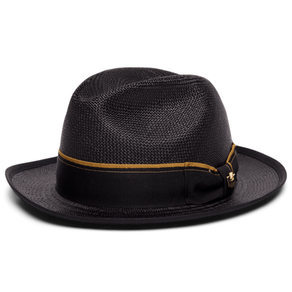 The Hartman by Goorin Bros. is a black fedora hat crafted from 100% toquilla, featuring a gold and black grosgrain band with a small decorative side bow, shown on a white background.
