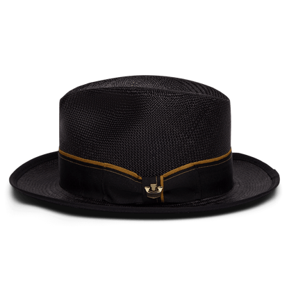 The Goorin Bros. Hartman hat is a black 100% toquilla woven style with a flat crown, slightly rounded brim with contrast edge binding, and a black band detailed with a thin gold stripe and gold clasp at the front.
