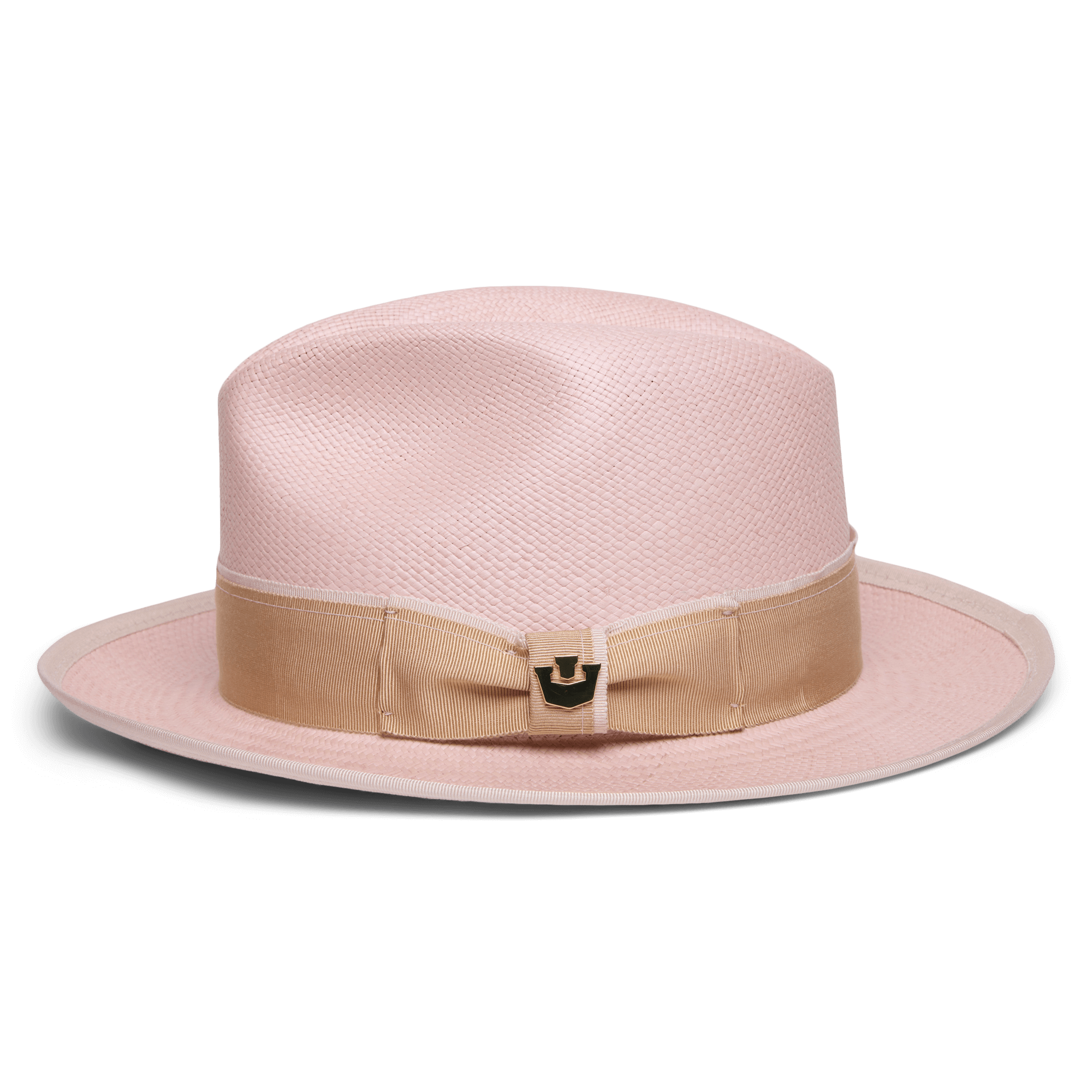 The Hartman by Goorin Bros. is a light pink fedora made from 100% toquilla, featuring a wide beige grosgrain band with bow, metallic accent, and contrast edge binding, displayed on a plain white background.